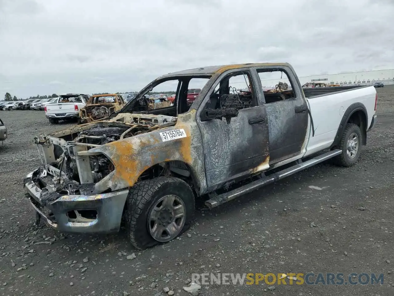 1 Photograph of a damaged car 3C6UR5HL8RG172389 RAM 2500 2024