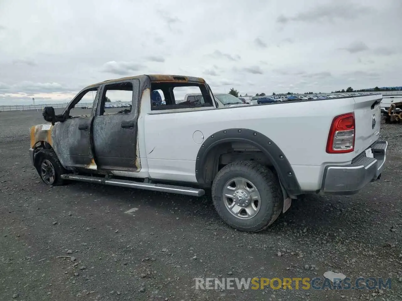 2 Photograph of a damaged car 3C6UR5HL8RG172389 RAM 2500 2024