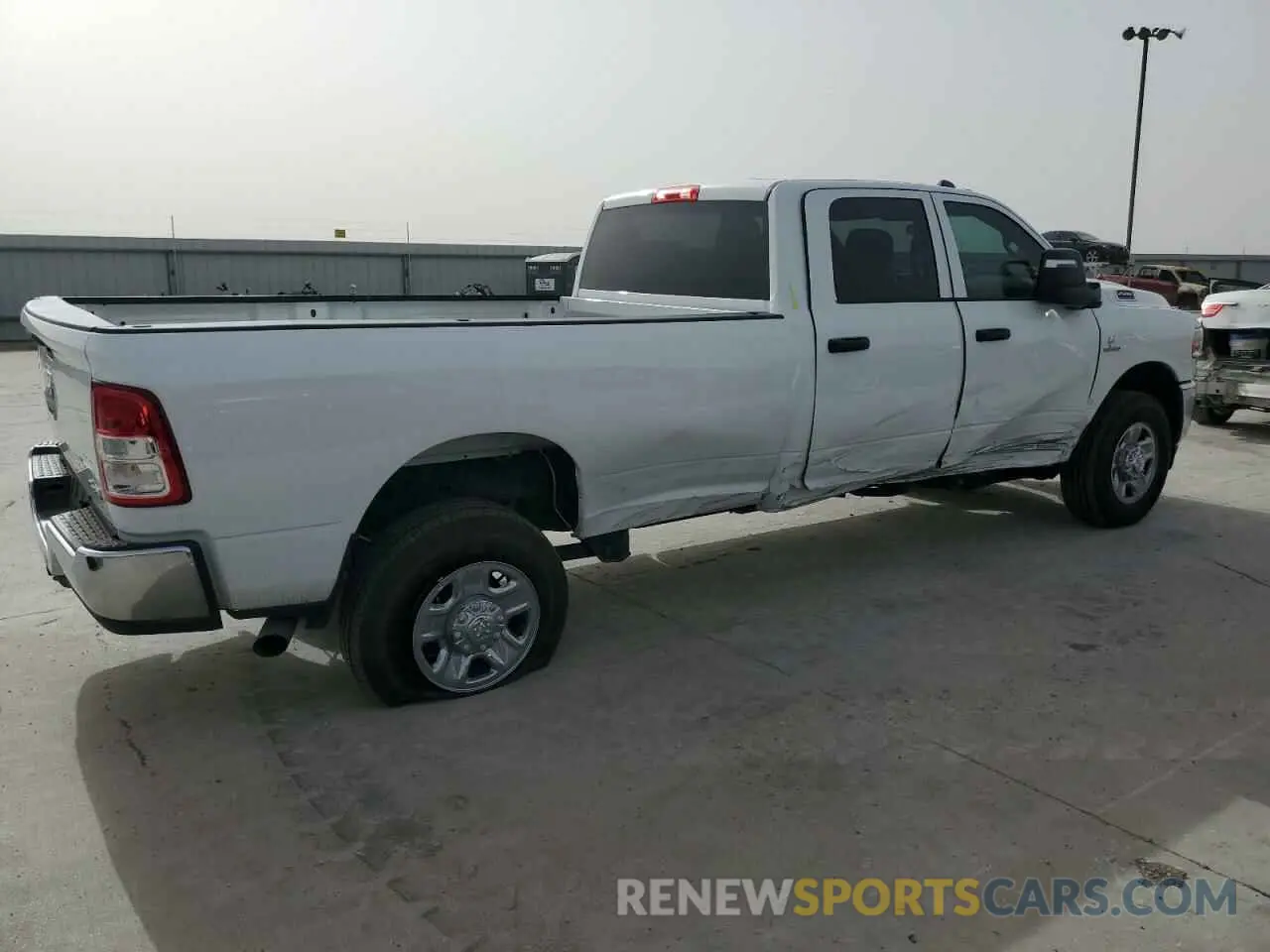 3 Photograph of a damaged car 3C6UR5HL8RG395452 RAM 2500 2024