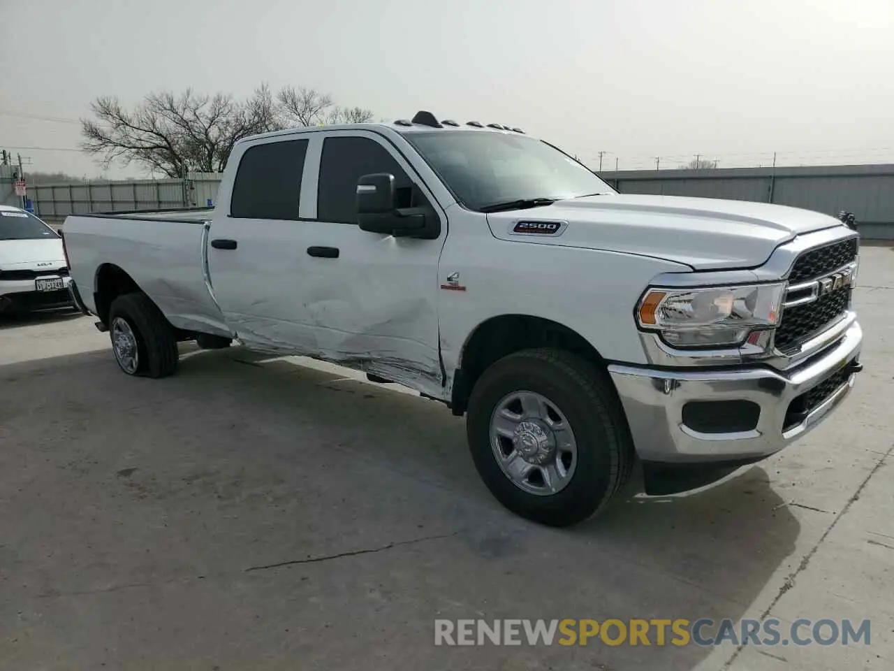 4 Photograph of a damaged car 3C6UR5HL8RG395452 RAM 2500 2024