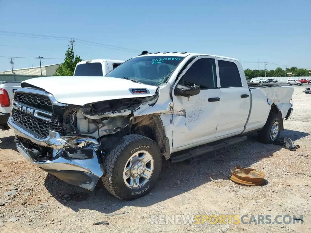 1 Photograph of a damaged car 3C6UR5HL9RG141202 RAM 2500 2024