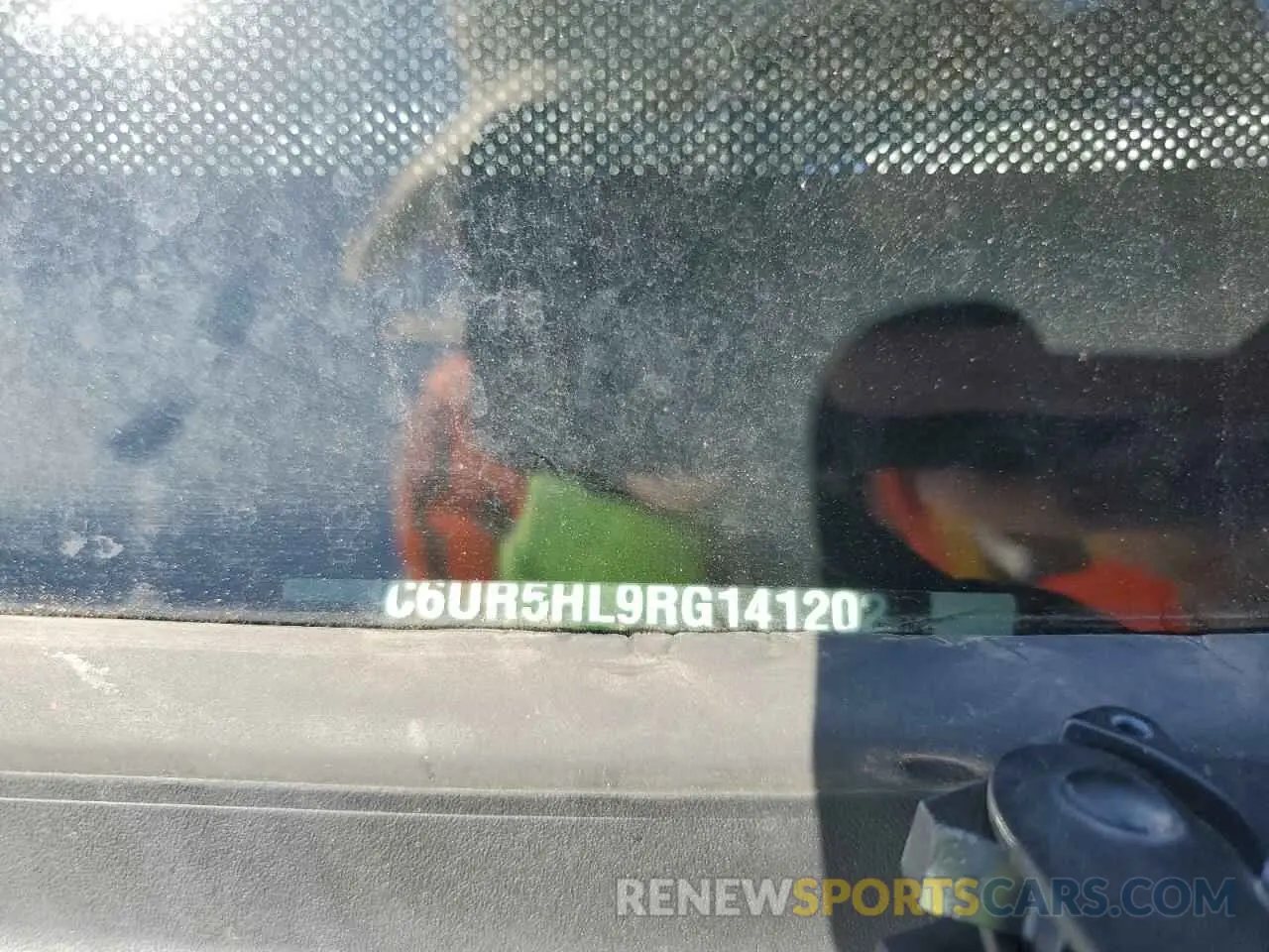 12 Photograph of a damaged car 3C6UR5HL9RG141202 RAM 2500 2024