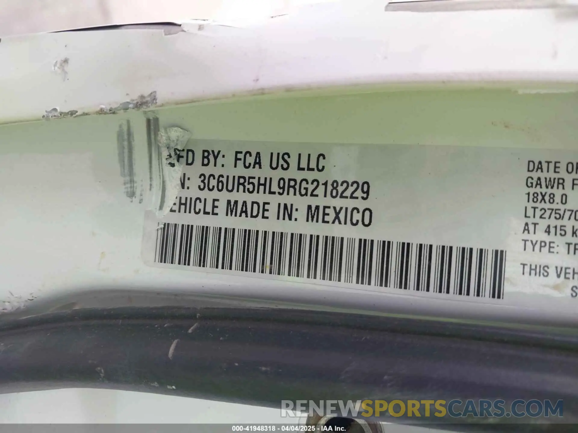 9 Photograph of a damaged car 3C6UR5HL9RG218229 RAM 2500 2024