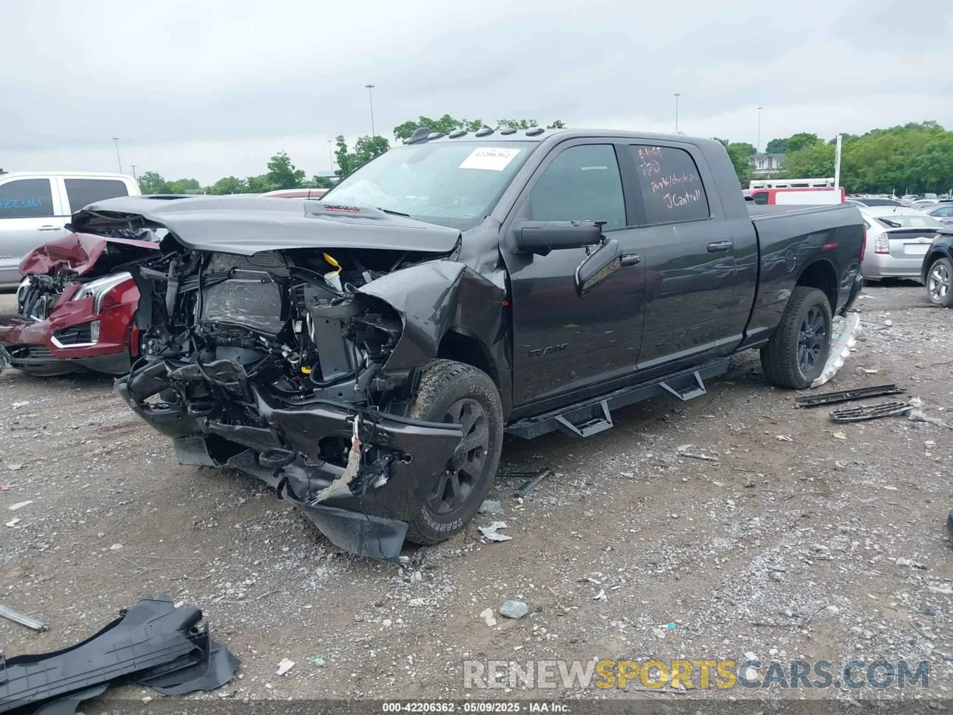 2 Photograph of a damaged car 3C6UR5NL0RG329918 RAM 2500 2024