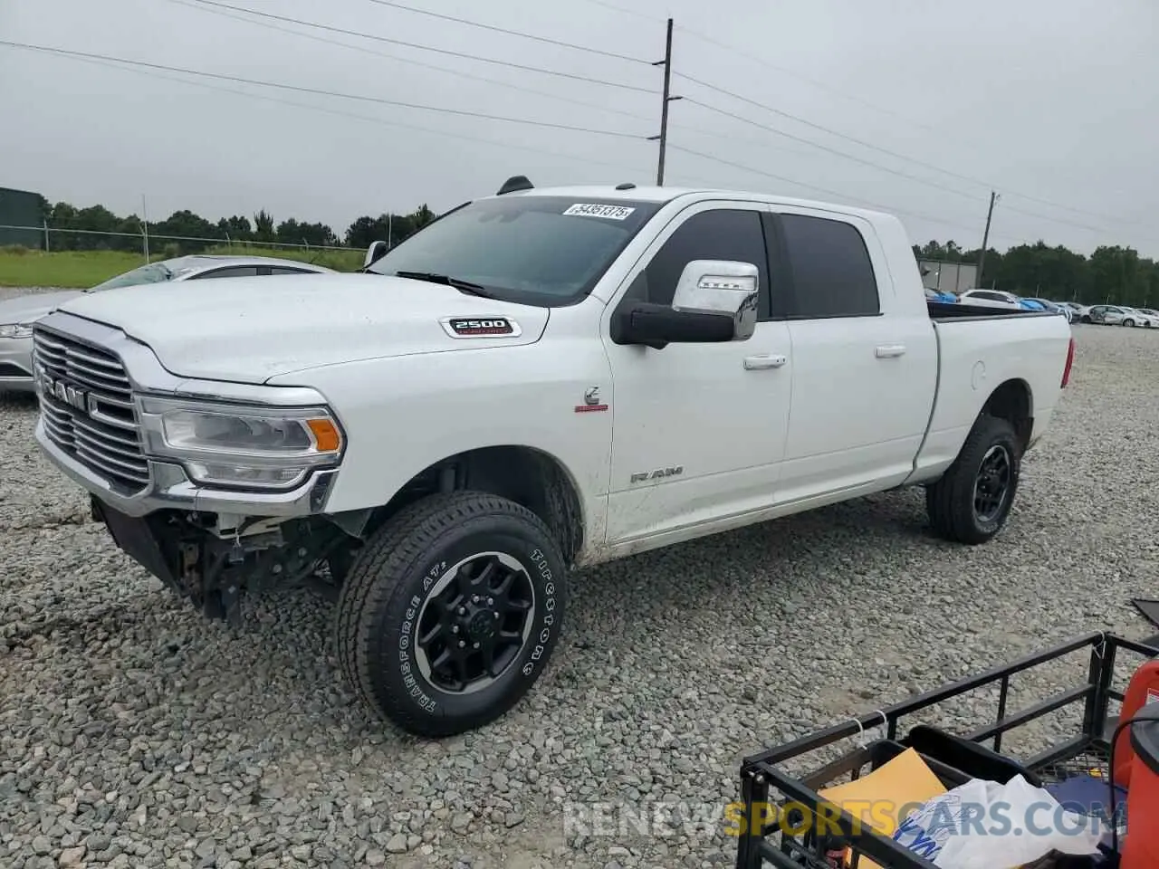 1 Photograph of a damaged car 3C6UR5NL4RG377891 RAM 2500 2024