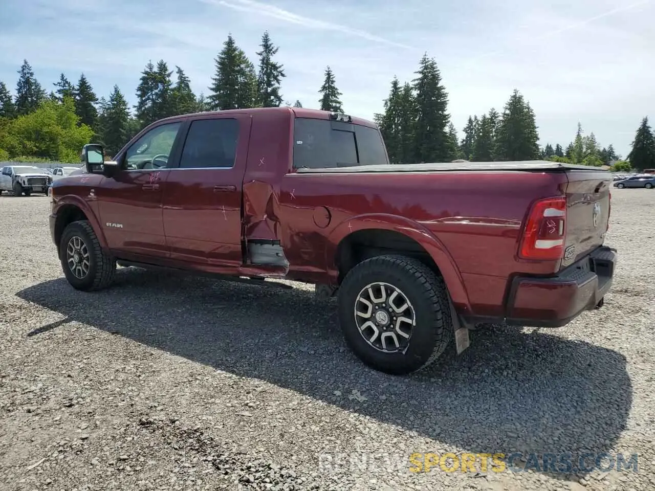 2 Photograph of a damaged car 3C6UR5PL2RG383945 RAM 2500 2024