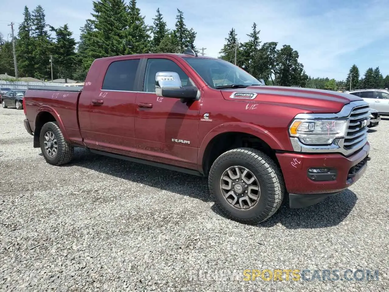 4 Photograph of a damaged car 3C6UR5PL2RG383945 RAM 2500 2024