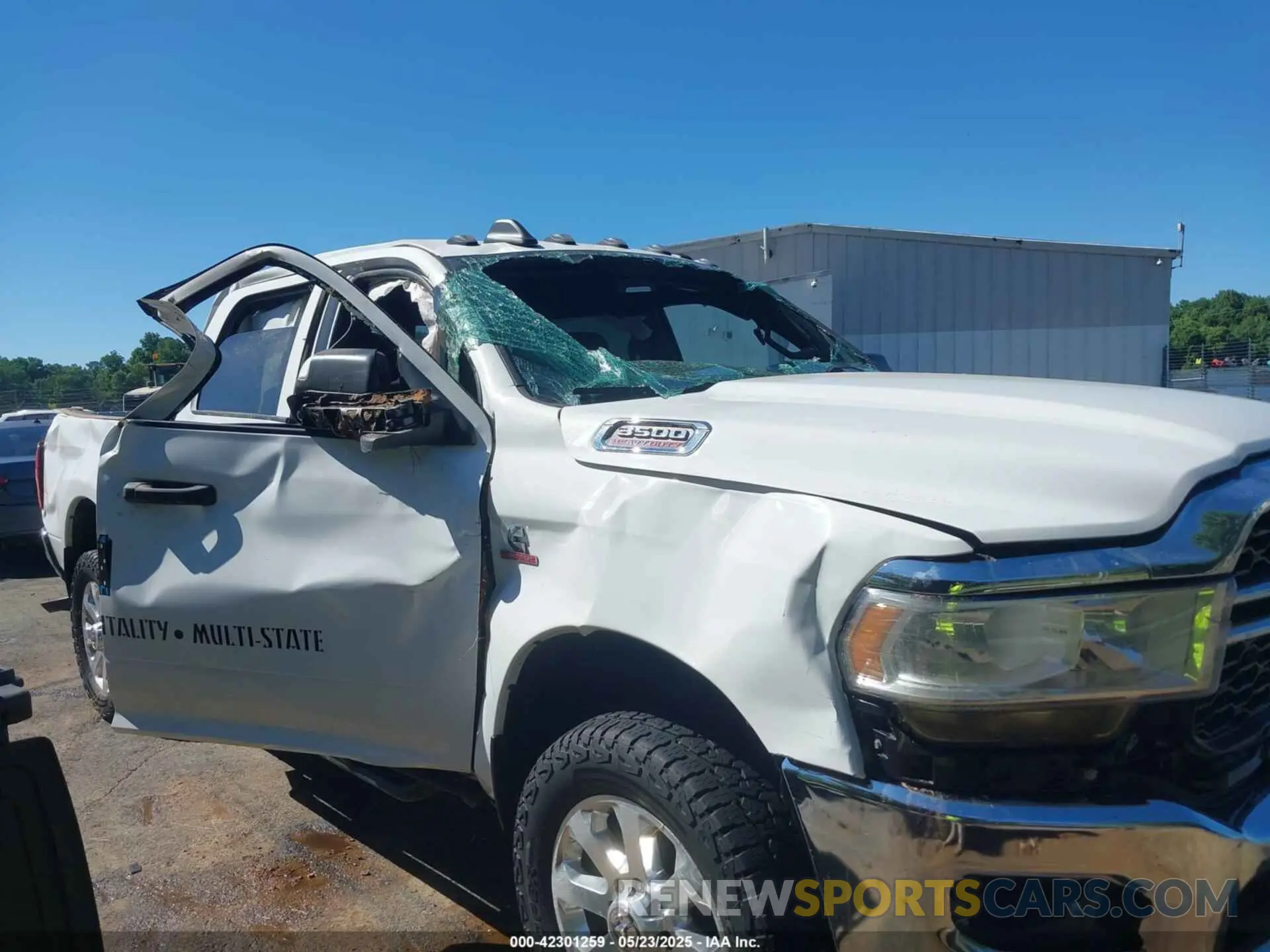 14 Photograph of a damaged car 3C63R3CL5MG550023 RAM 3500 2021