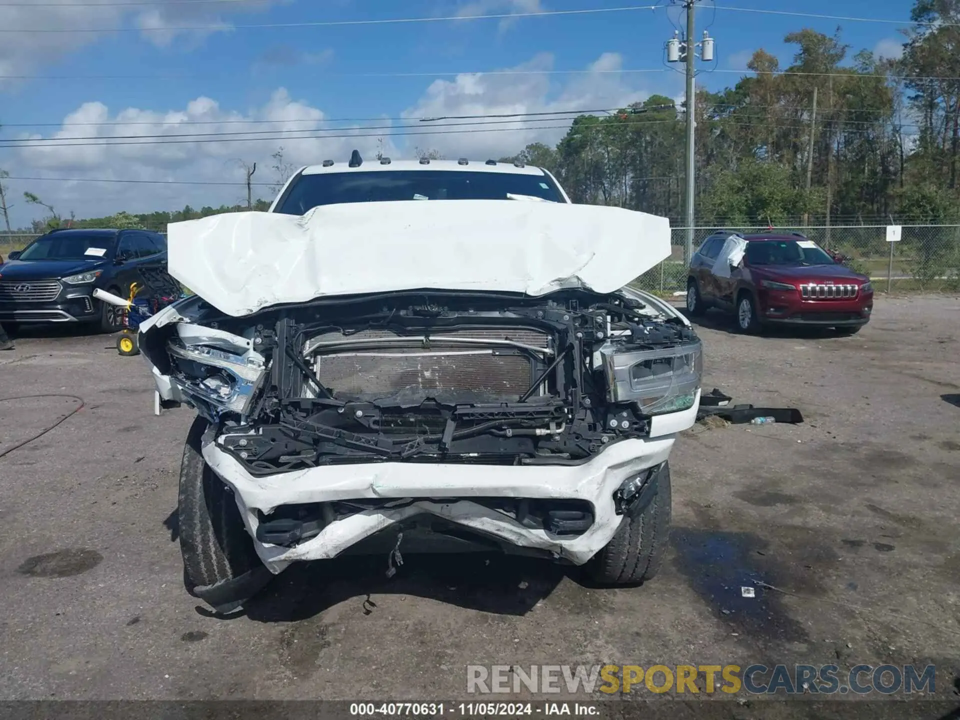 12 Photograph of a damaged car 3C63R3EL3NG353074 RAM 3500 2022