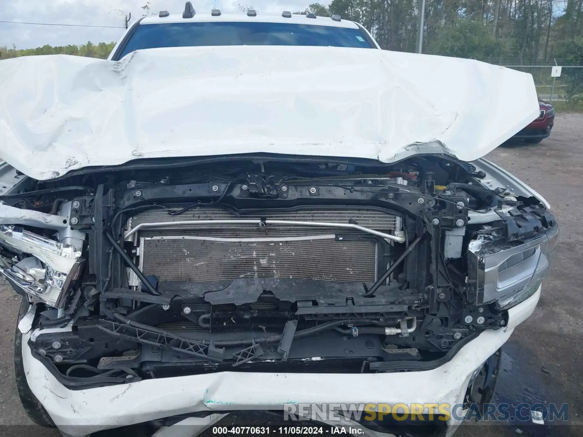 6 Photograph of a damaged car 3C63R3EL3NG353074 RAM 3500 2022