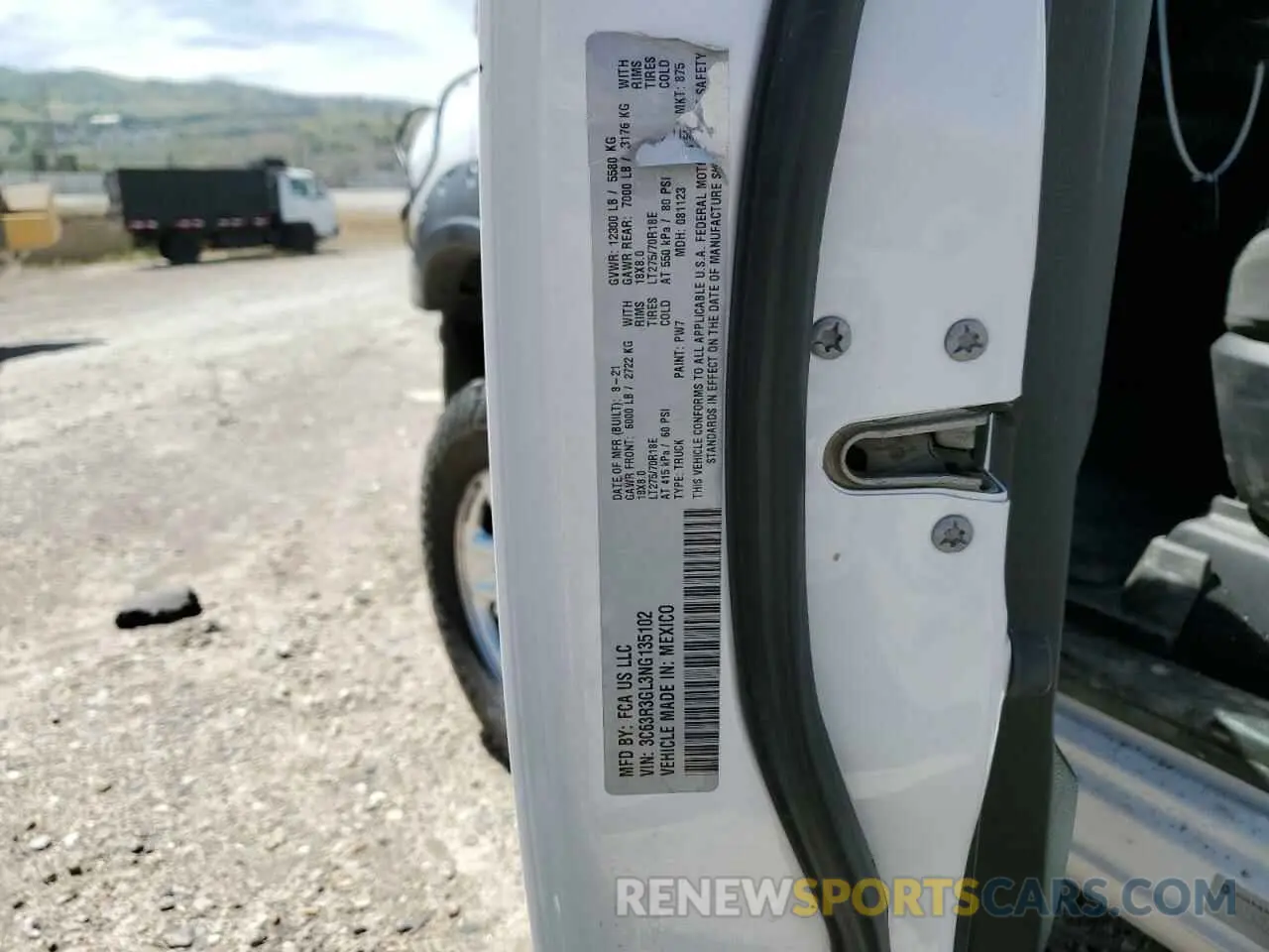 13 Photograph of a damaged car 3C63R3GL3NG135102 RAM 3500 2022