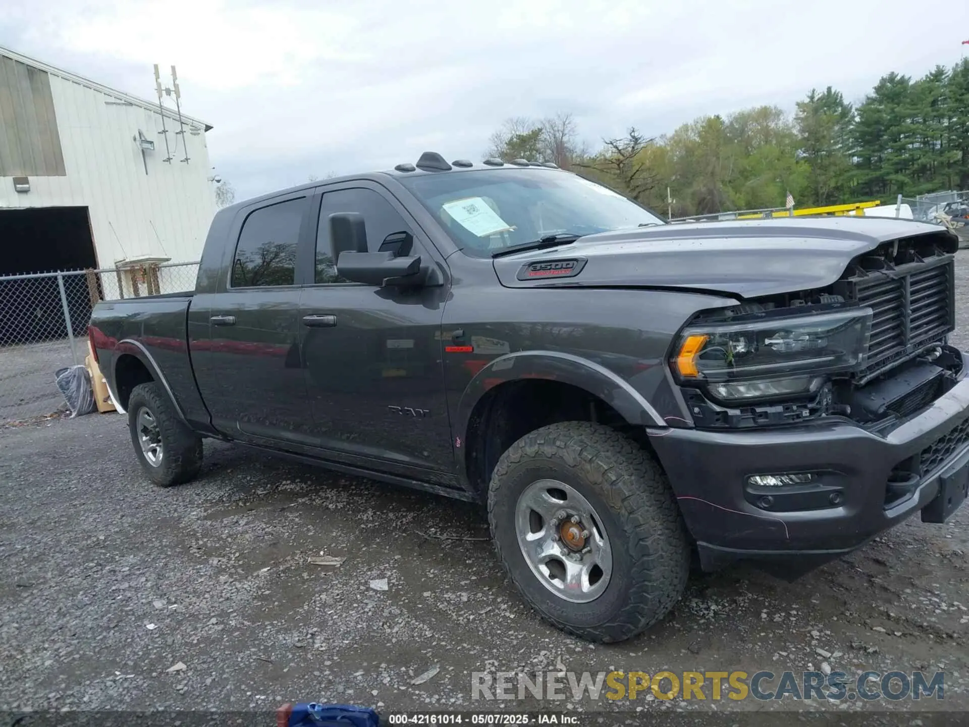 14 Photograph of a damaged car 3C63R3PL1NG304324 RAM 3500 2022