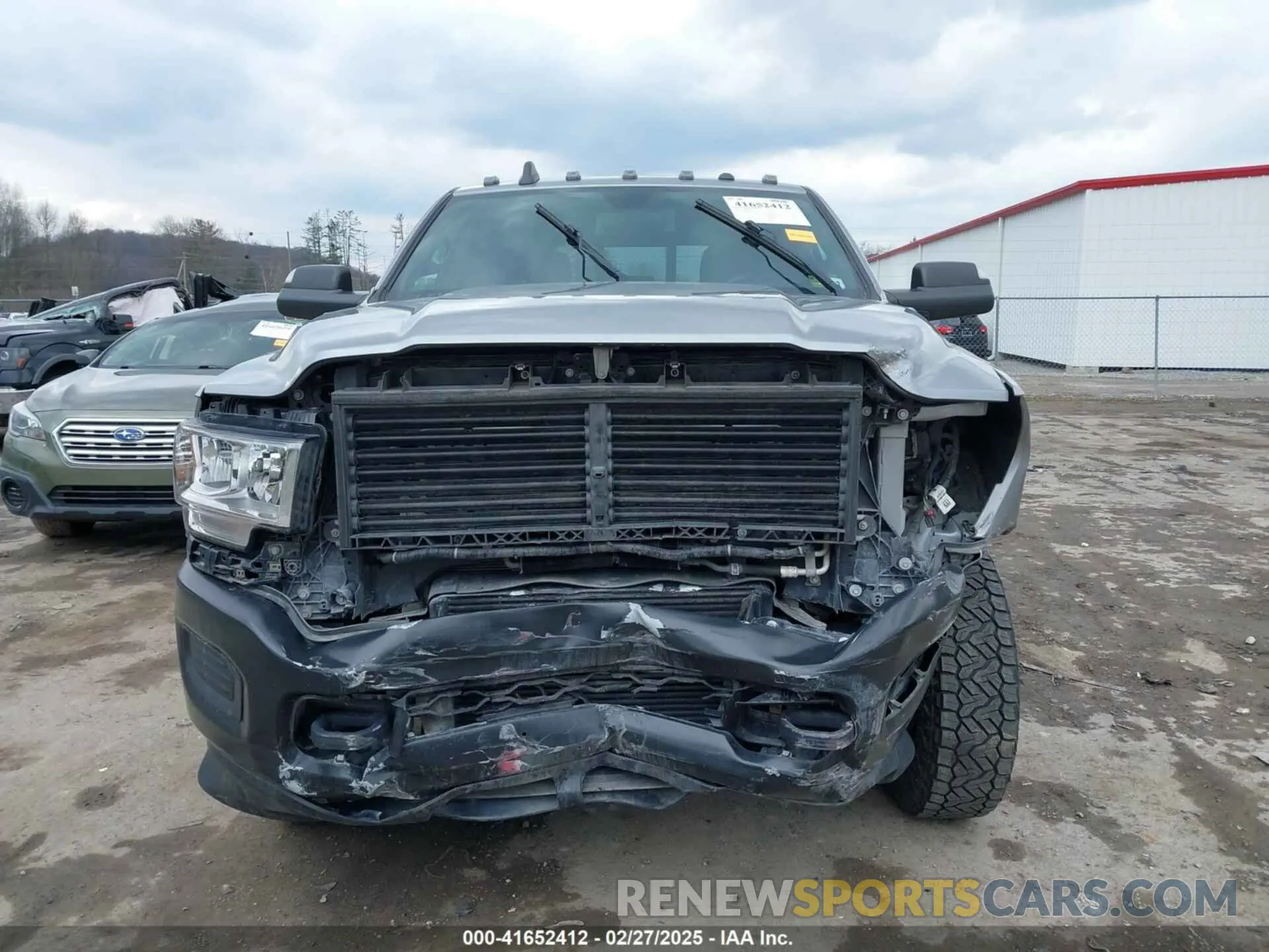 13 Photograph of a damaged car 3C63RRGL0NG114484 RAM 3500 2022