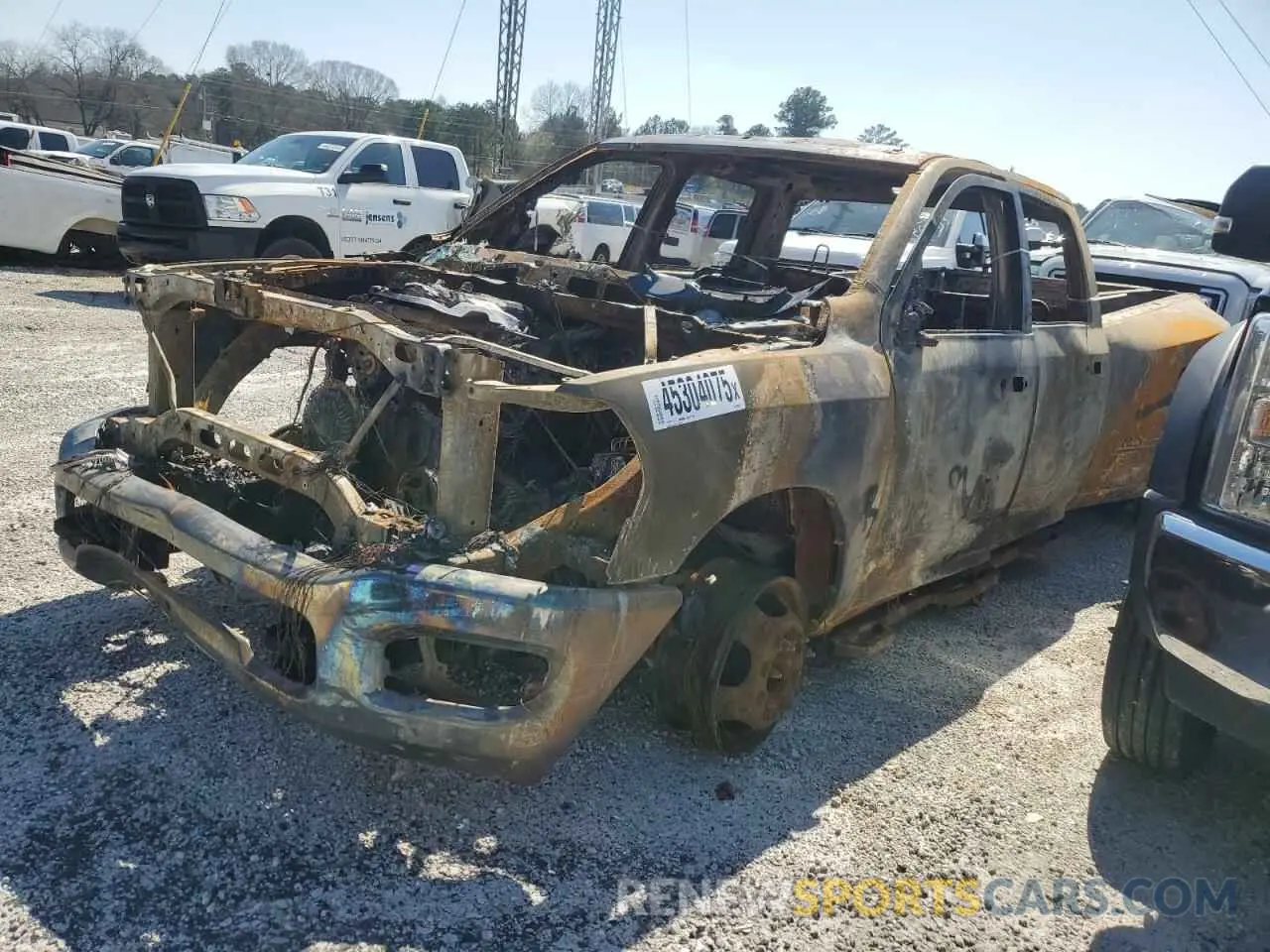 1 Photograph of a damaged car 3C63RRGLXPG623758 RAM 3500 2023