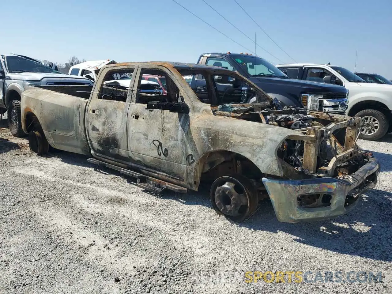 4 Photograph of a damaged car 3C63RRGLXPG623758 RAM 3500 2023