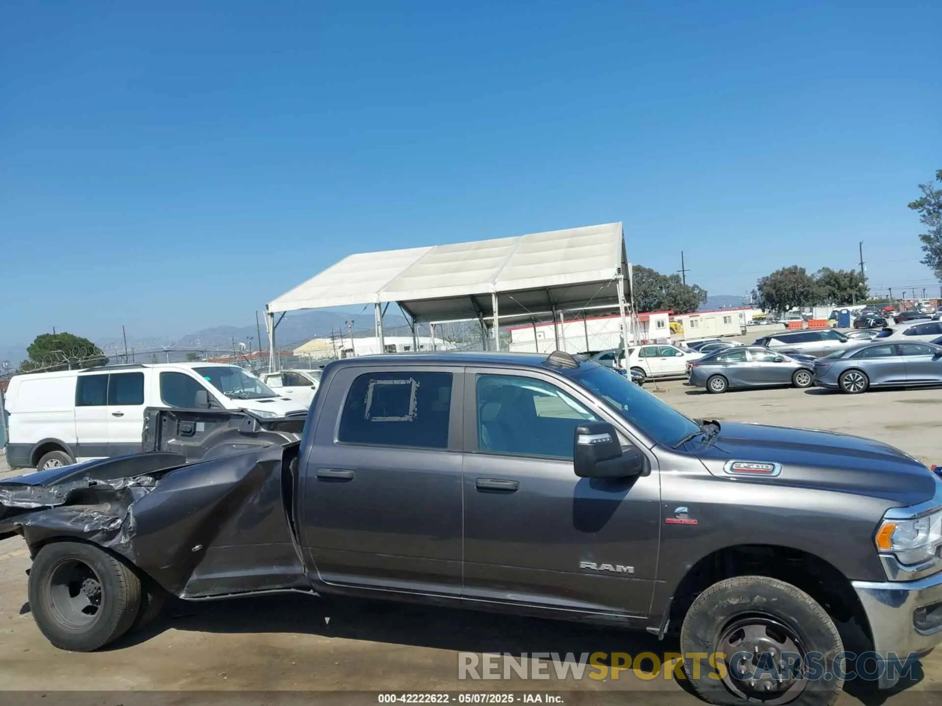 14 Photograph of a damaged car 3C63RRHL3PG542213 RAM 3500 2023