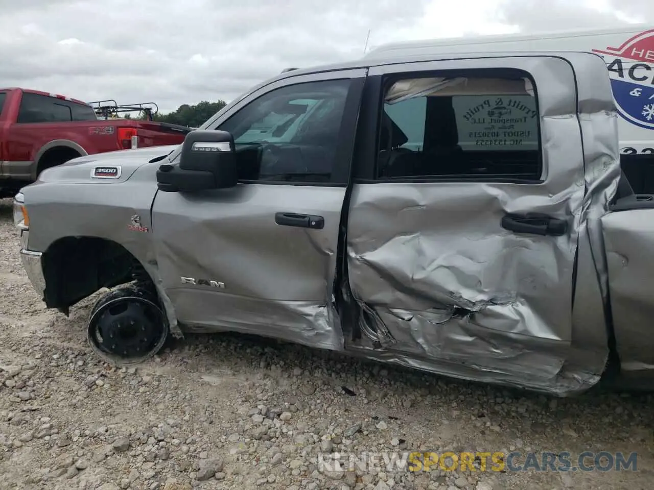 9 Photograph of a damaged car 3C63RRHL6PG573858 RAM 3500 2023