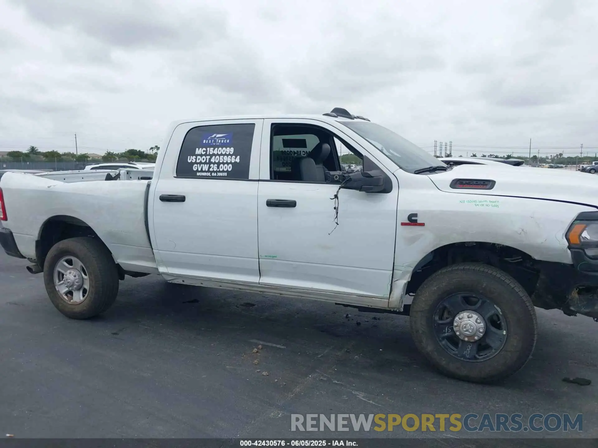 14 Photograph of a damaged car 3C63R3CL4RG380261 RAM 3500 2024