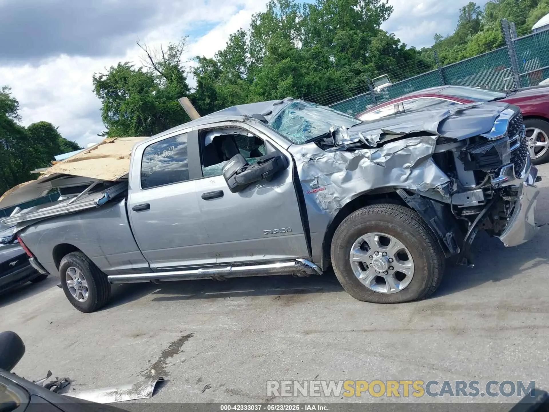 15 Photograph of a damaged car 3C63R3HL1RG198705 RAM 3500 2024