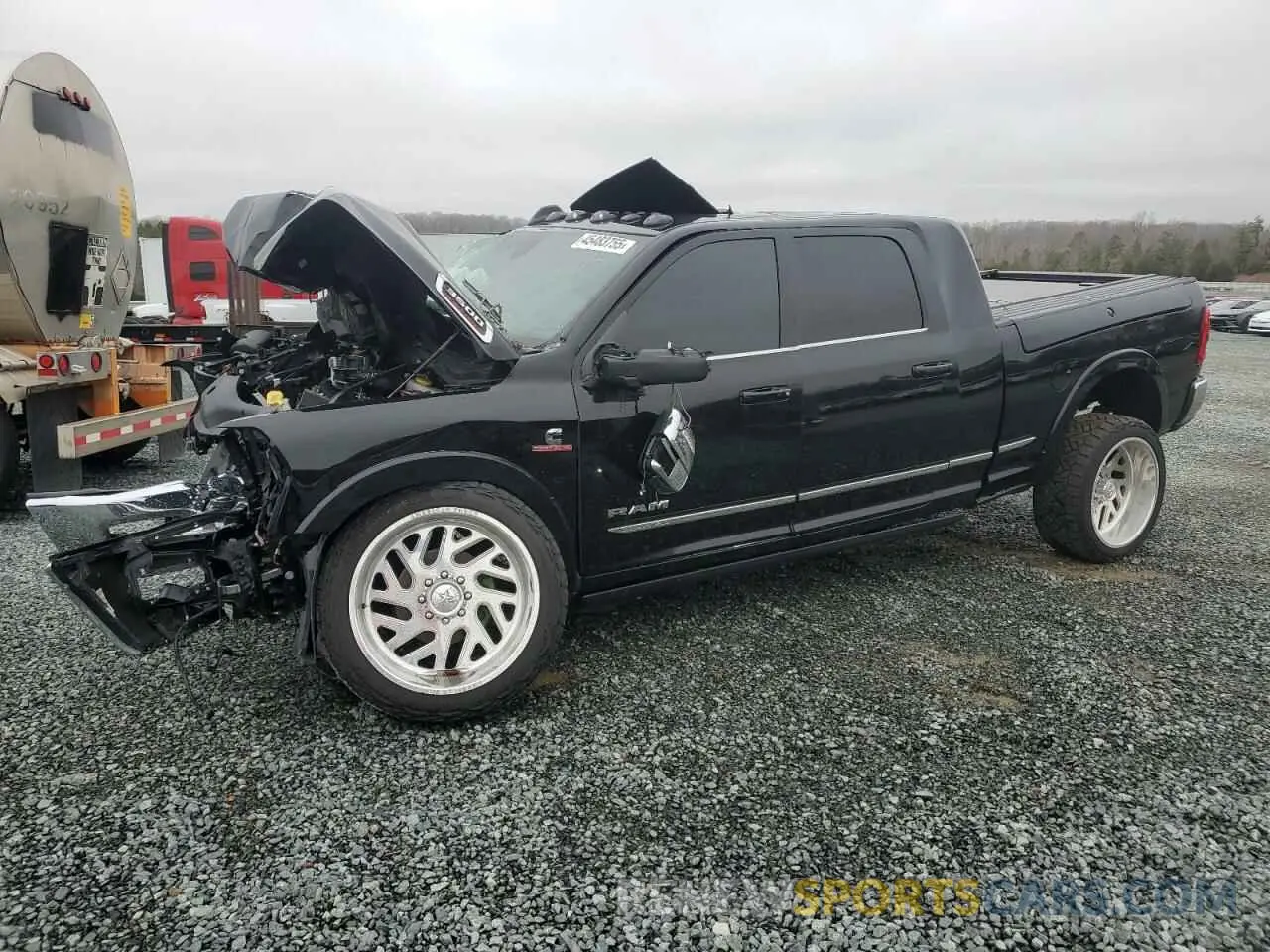 1 Photograph of a damaged car 3C63R3PL5RG151436 RAM 3500 2024