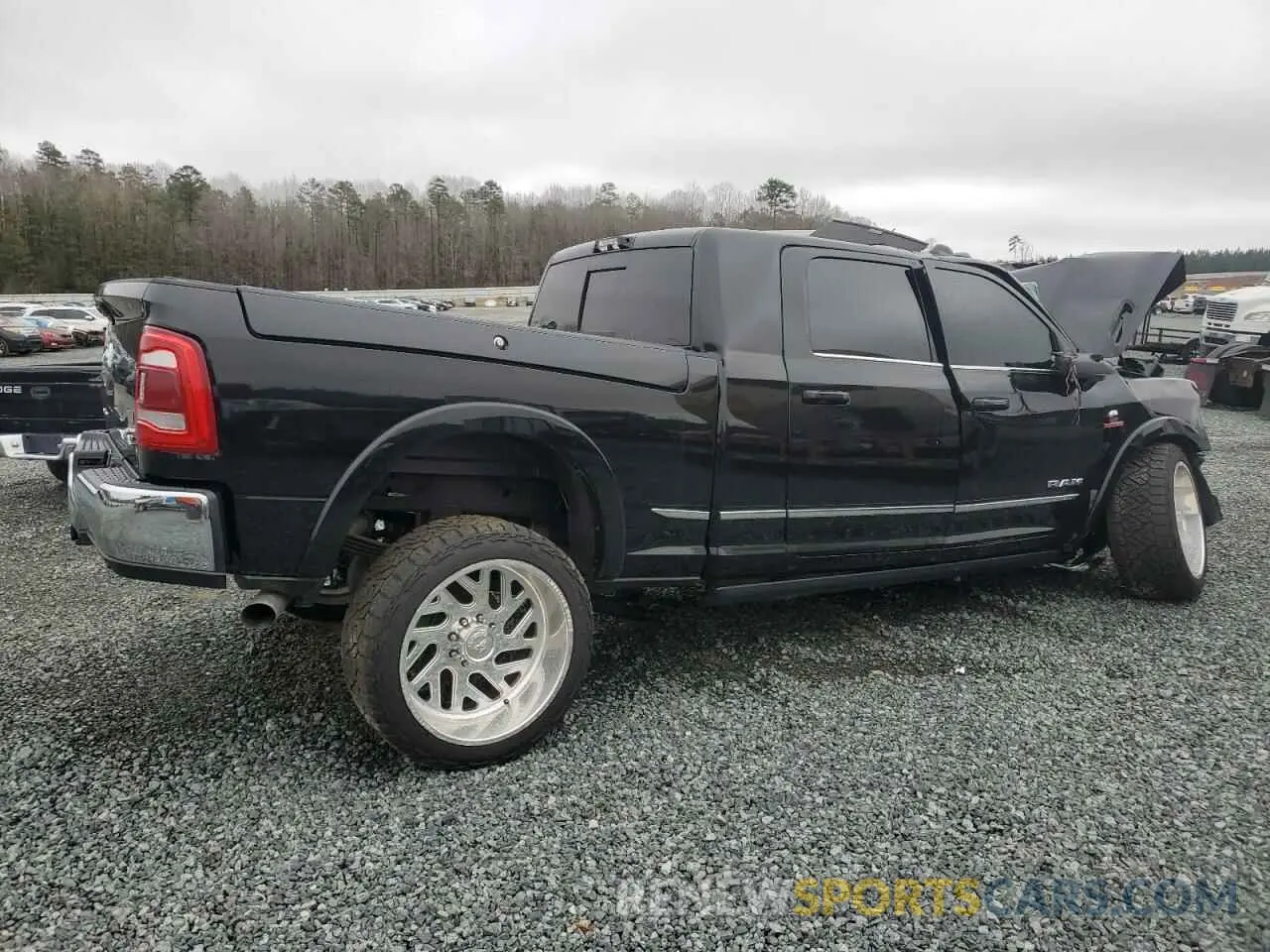 3 Photograph of a damaged car 3C63R3PL5RG151436 RAM 3500 2024