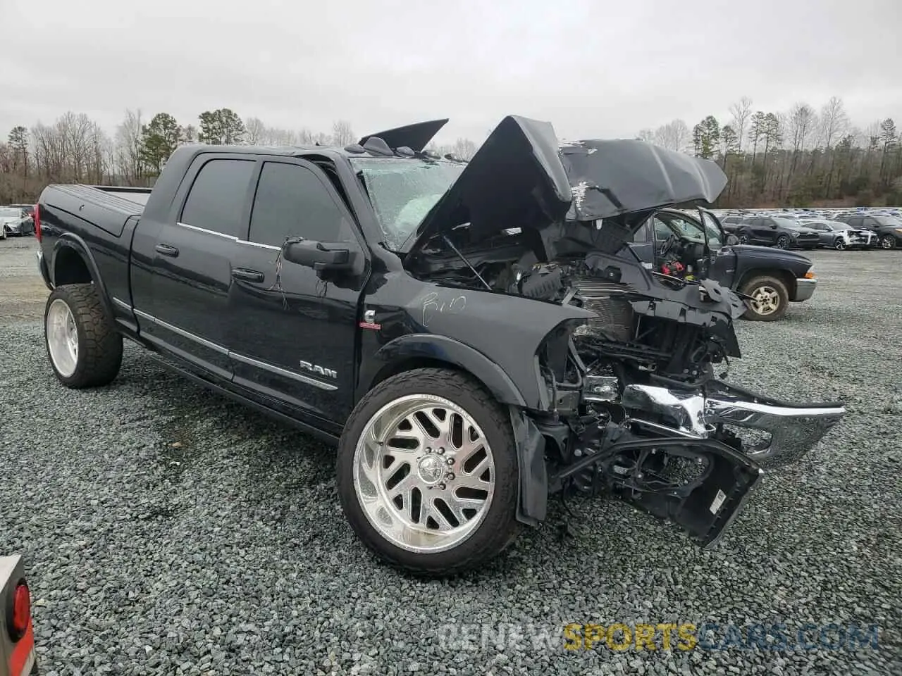 4 Photograph of a damaged car 3C63R3PL5RG151436 RAM 3500 2024