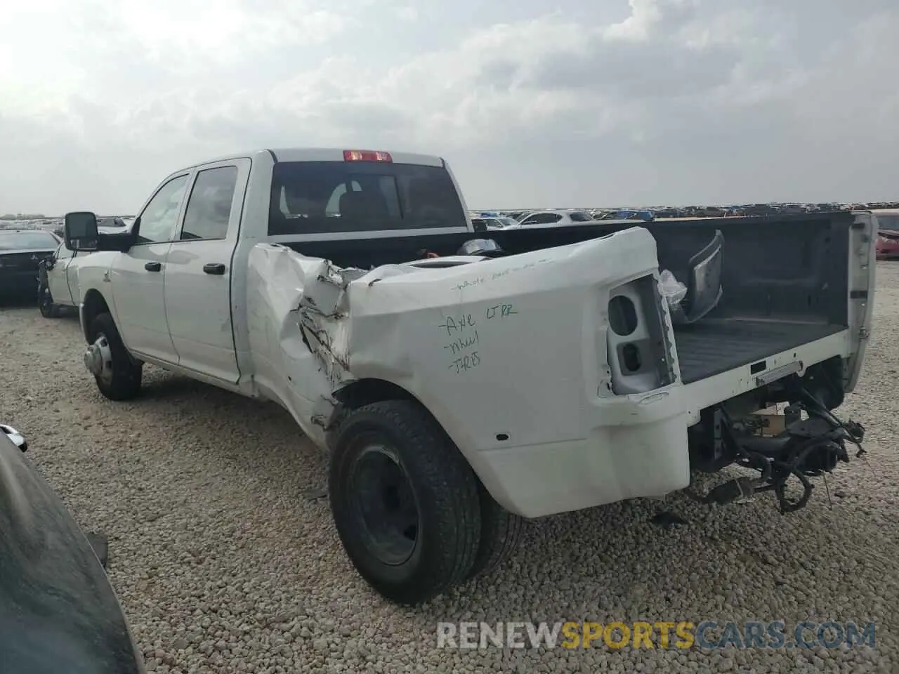 2 Photograph of a damaged car 3C63RRGL2RG198927 RAM 3500 2024