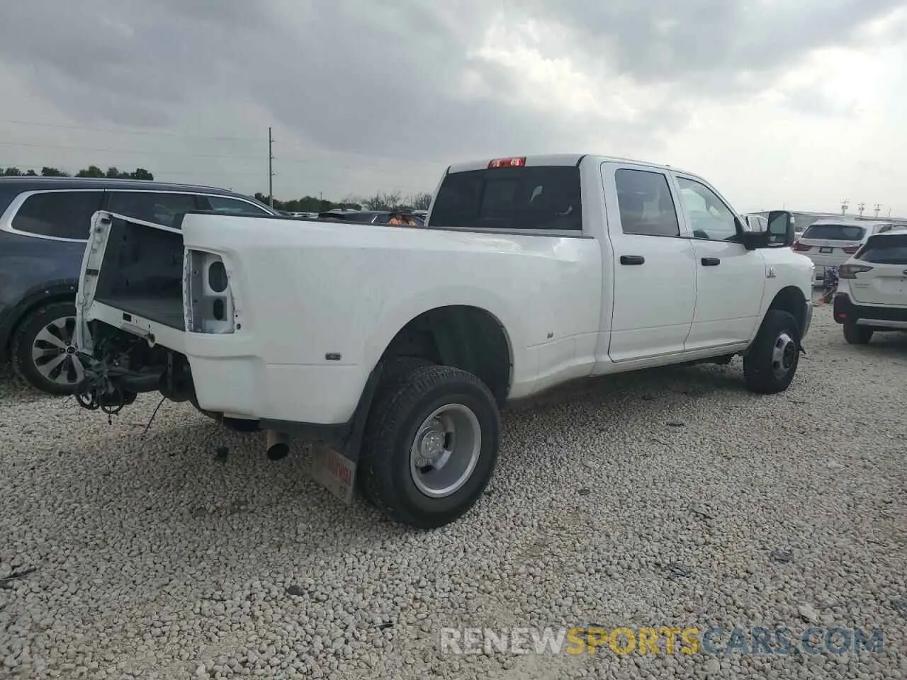 3 Photograph of a damaged car 3C63RRGL2RG198927 RAM 3500 2024