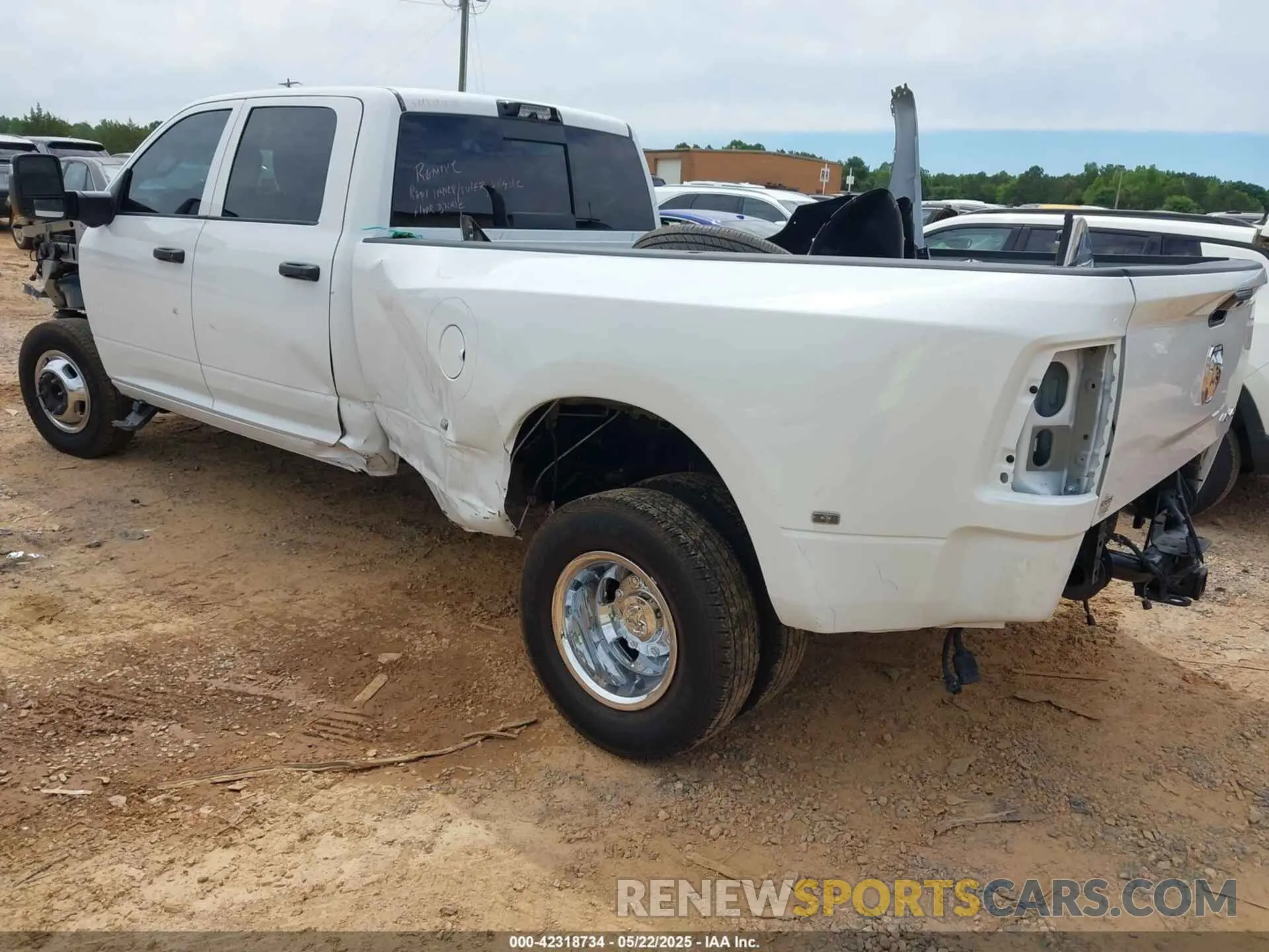 3 Photograph of a damaged car 3C63RRGL6RG307826 RAM 3500 2024
