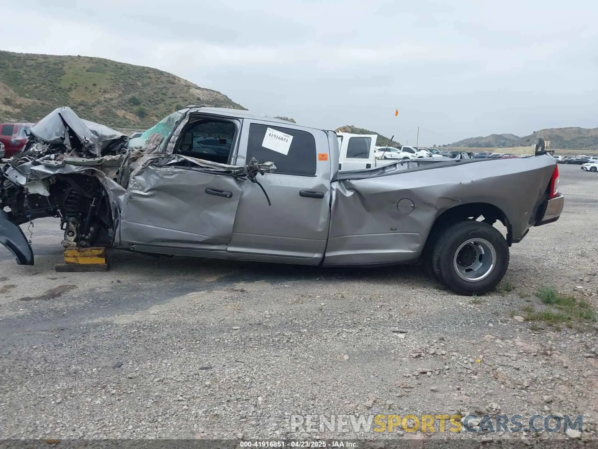 3 Photograph of a damaged car 3C63RRGL7RG321265 RAM 3500 2024