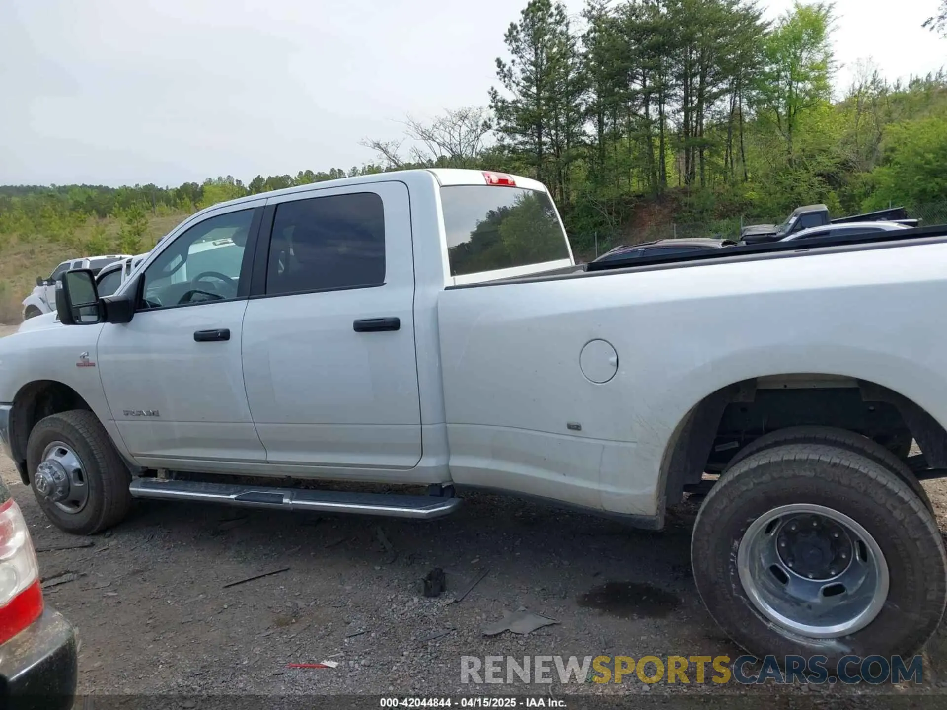 14 Photograph of a damaged car 3C63RRHL1RG271767 RAM 3500 2024