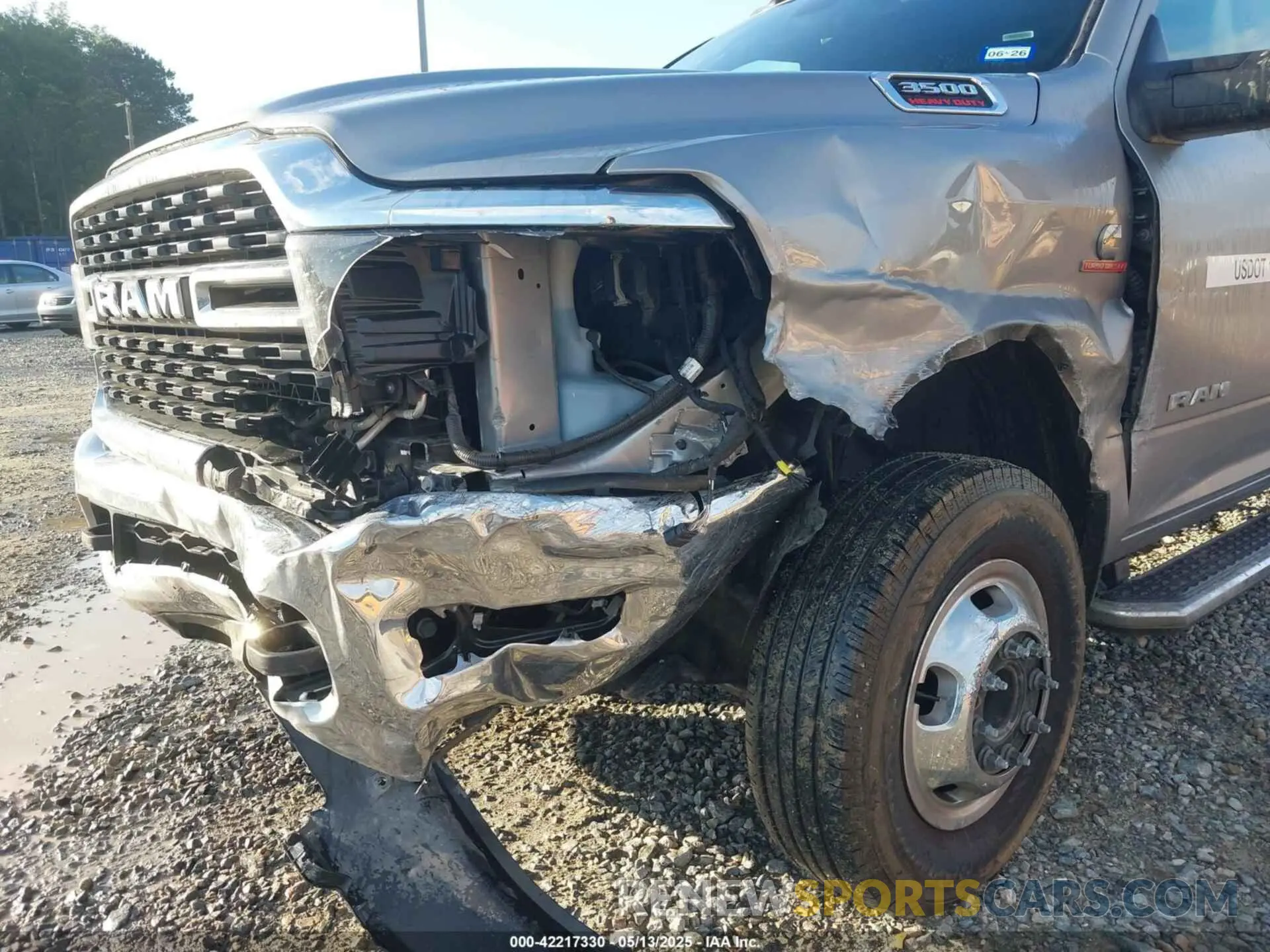 11 Photograph of a damaged car 3C63RRHL1RG337184 RAM 3500 2024