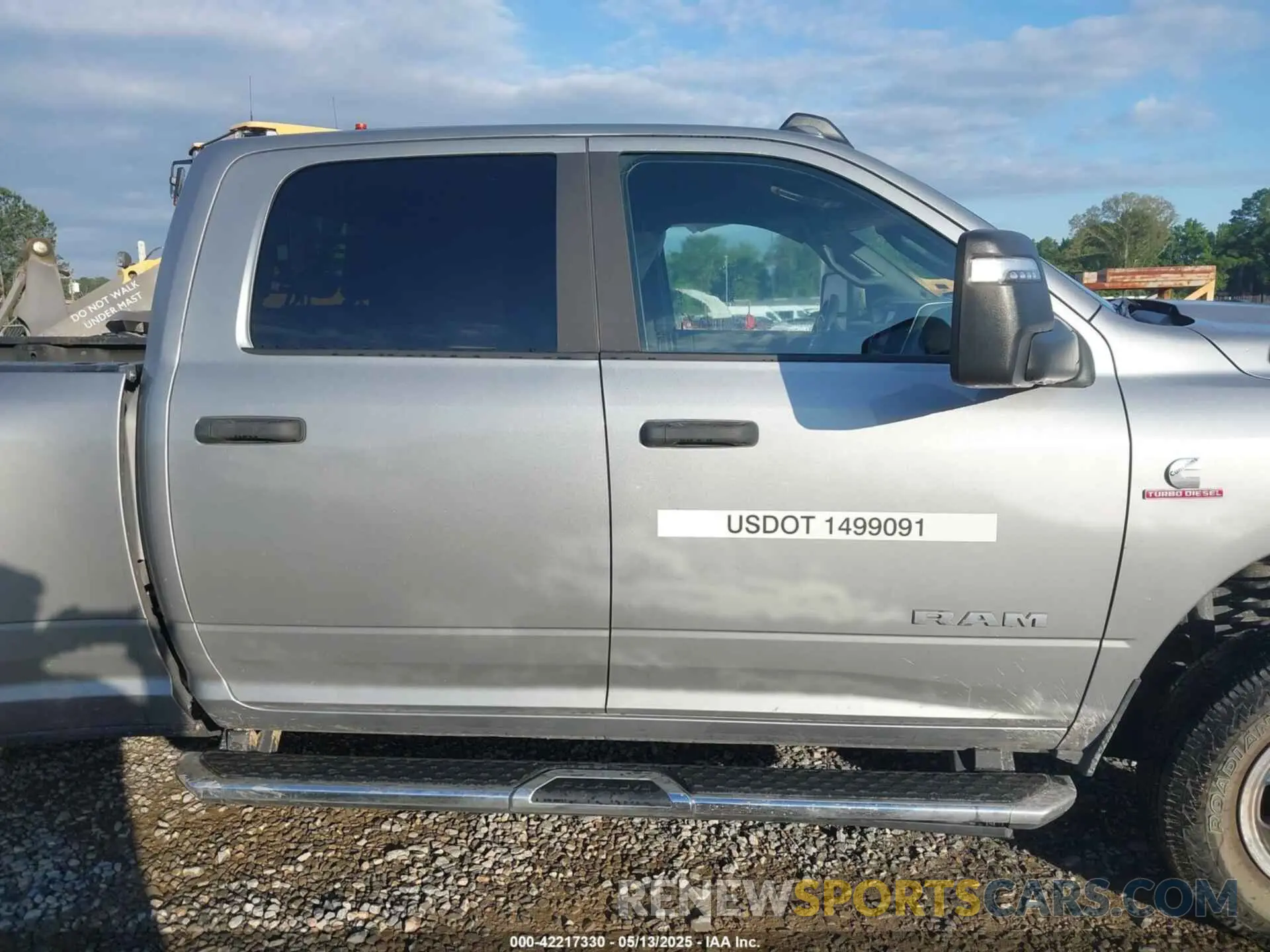 13 Photograph of a damaged car 3C63RRHL1RG337184 RAM 3500 2024