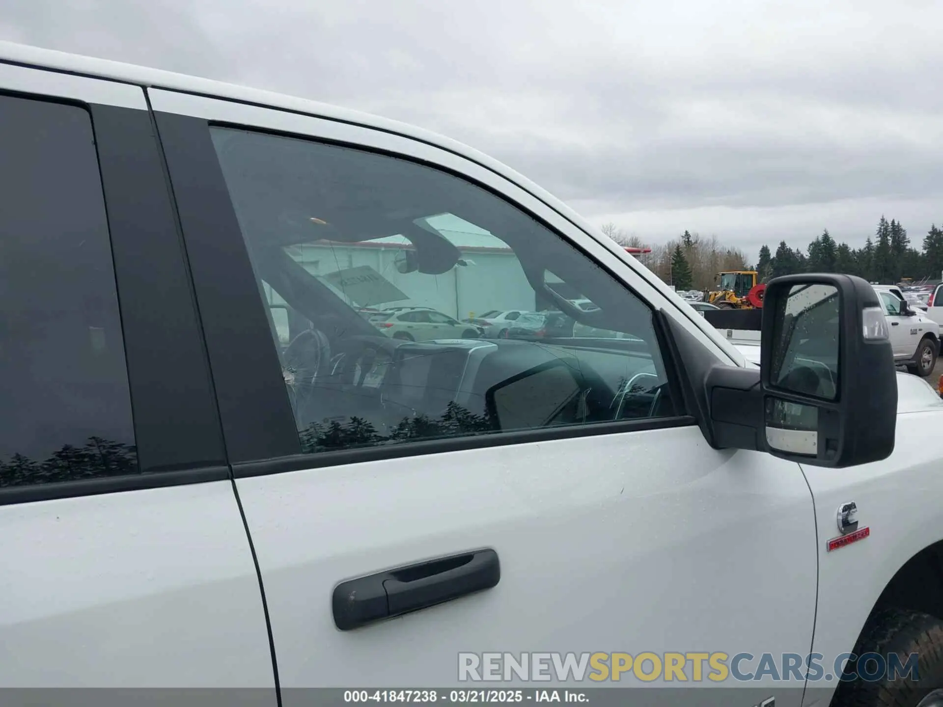 11 Photograph of a damaged car 3C63RRHL4RG271732 RAM 3500 2024