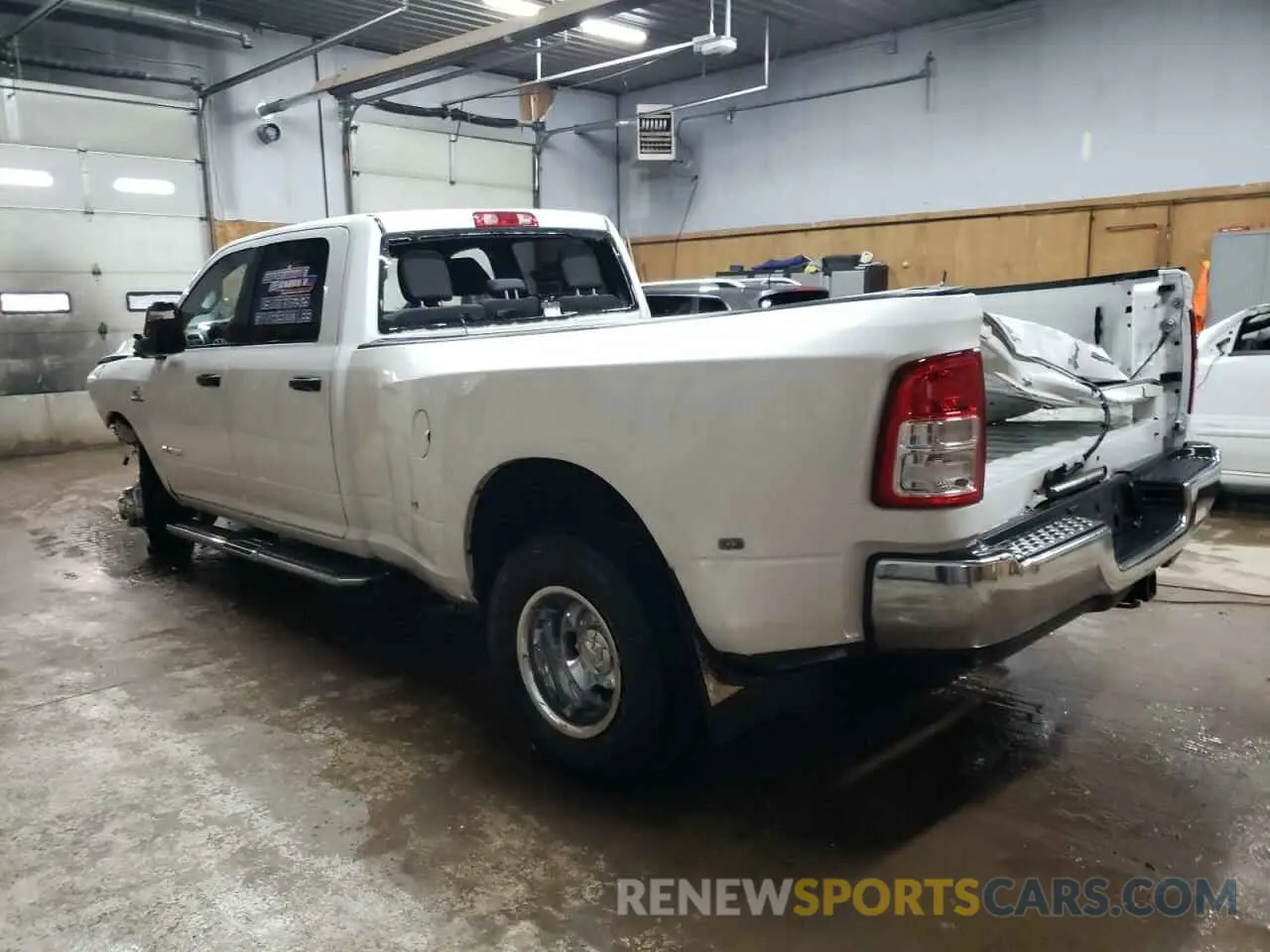 2 Photograph of a damaged car 3C63RRHL5RG341383 RAM 3500 2024