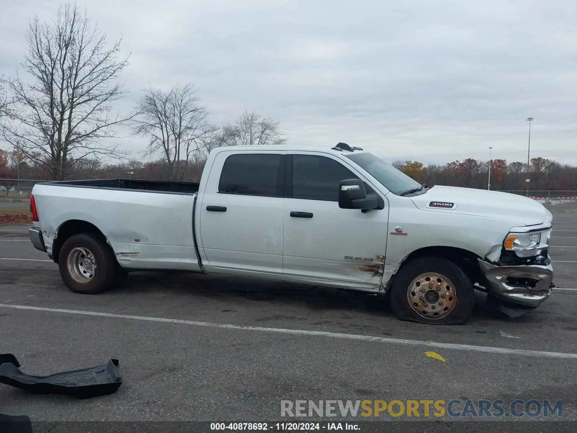 13 Photograph of a damaged car 3C63RRHL8RG150394 RAM 3500 2024