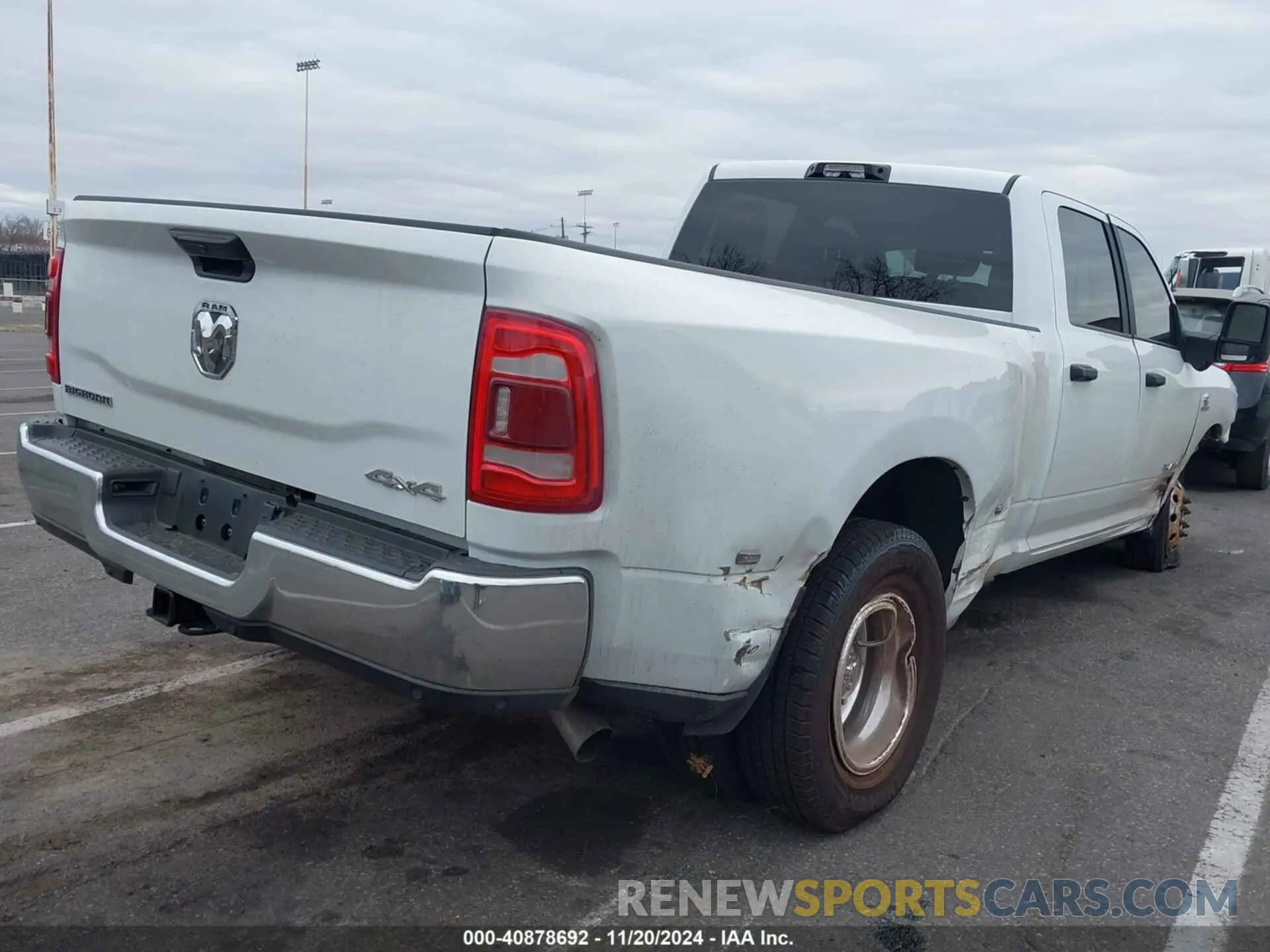 4 Photograph of a damaged car 3C63RRHL8RG150394 RAM 3500 2024