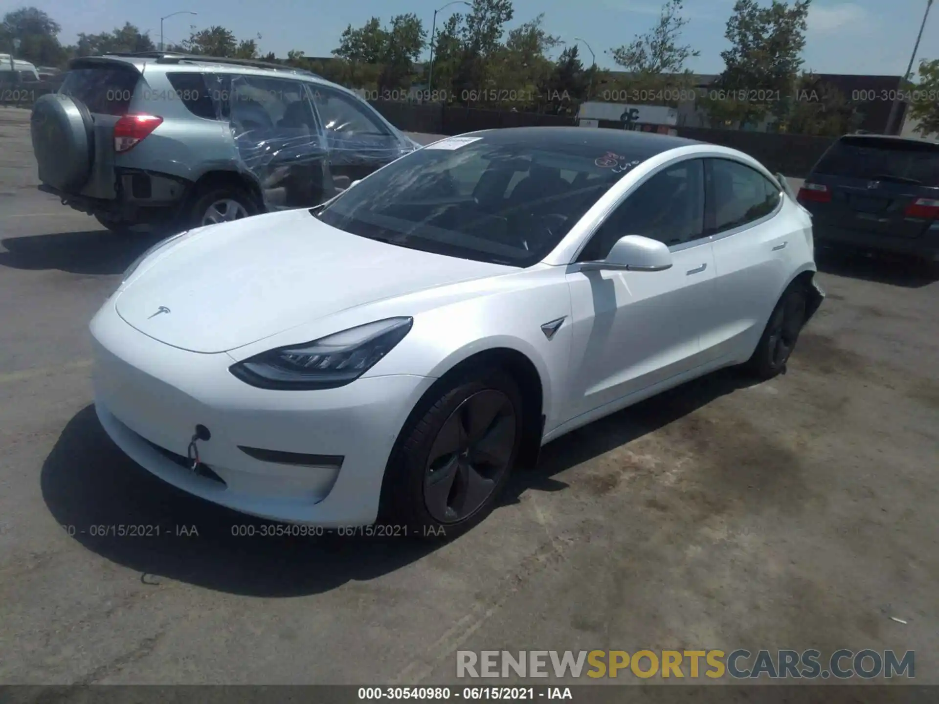 2 Photograph of a damaged car 5YJ3E1EA0LF612341 TESLA MODEL 3 2020