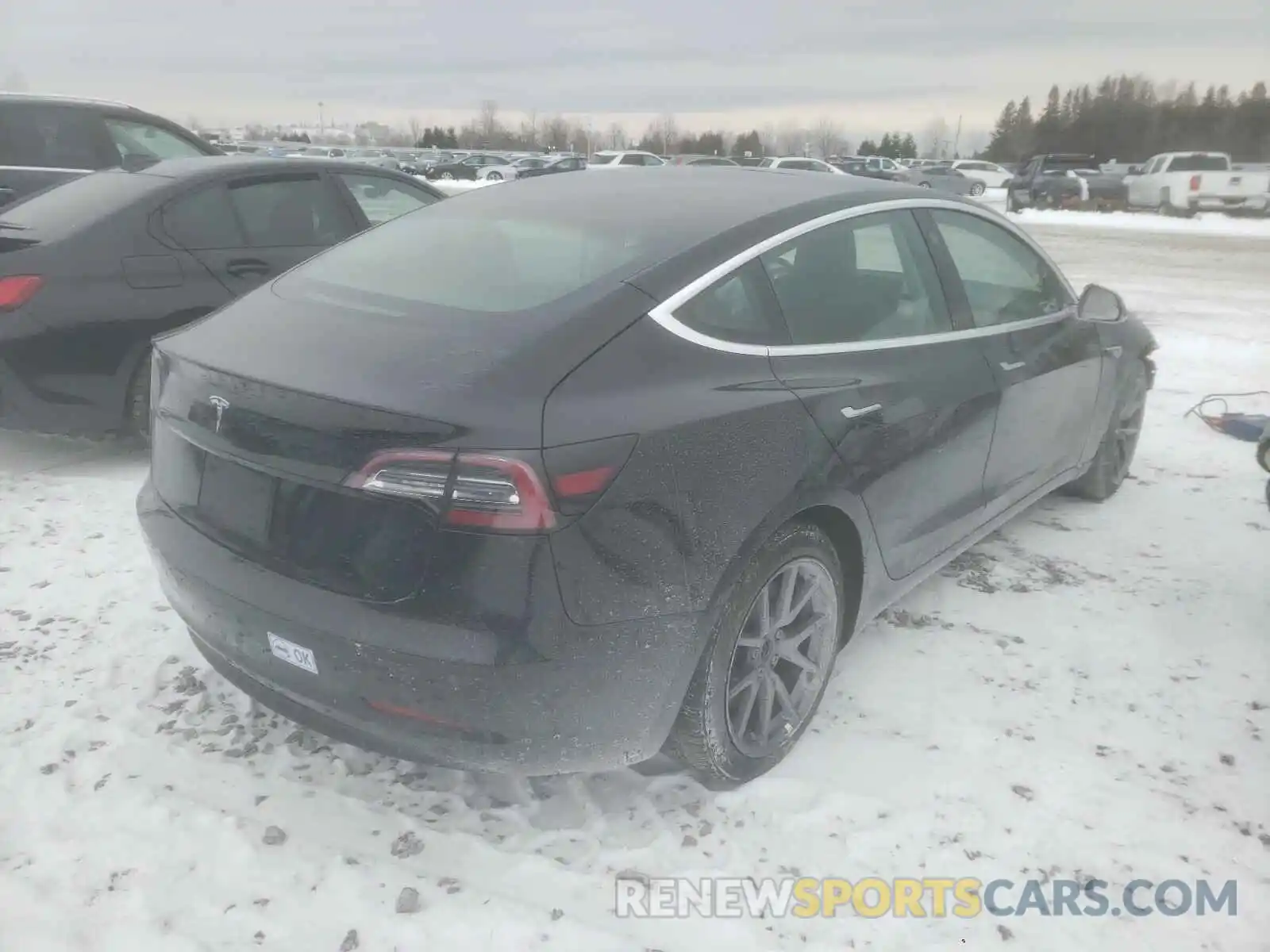 4 Photograph of a damaged car 5YJ3E1EA0LF738439 TESLA MODEL 3 2020