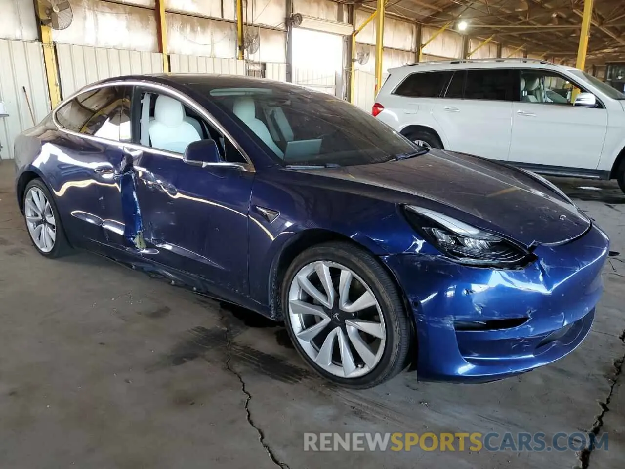 4 Photograph of a damaged car 5YJ3E1EA1LF744069 TESLA MODEL 3 2020