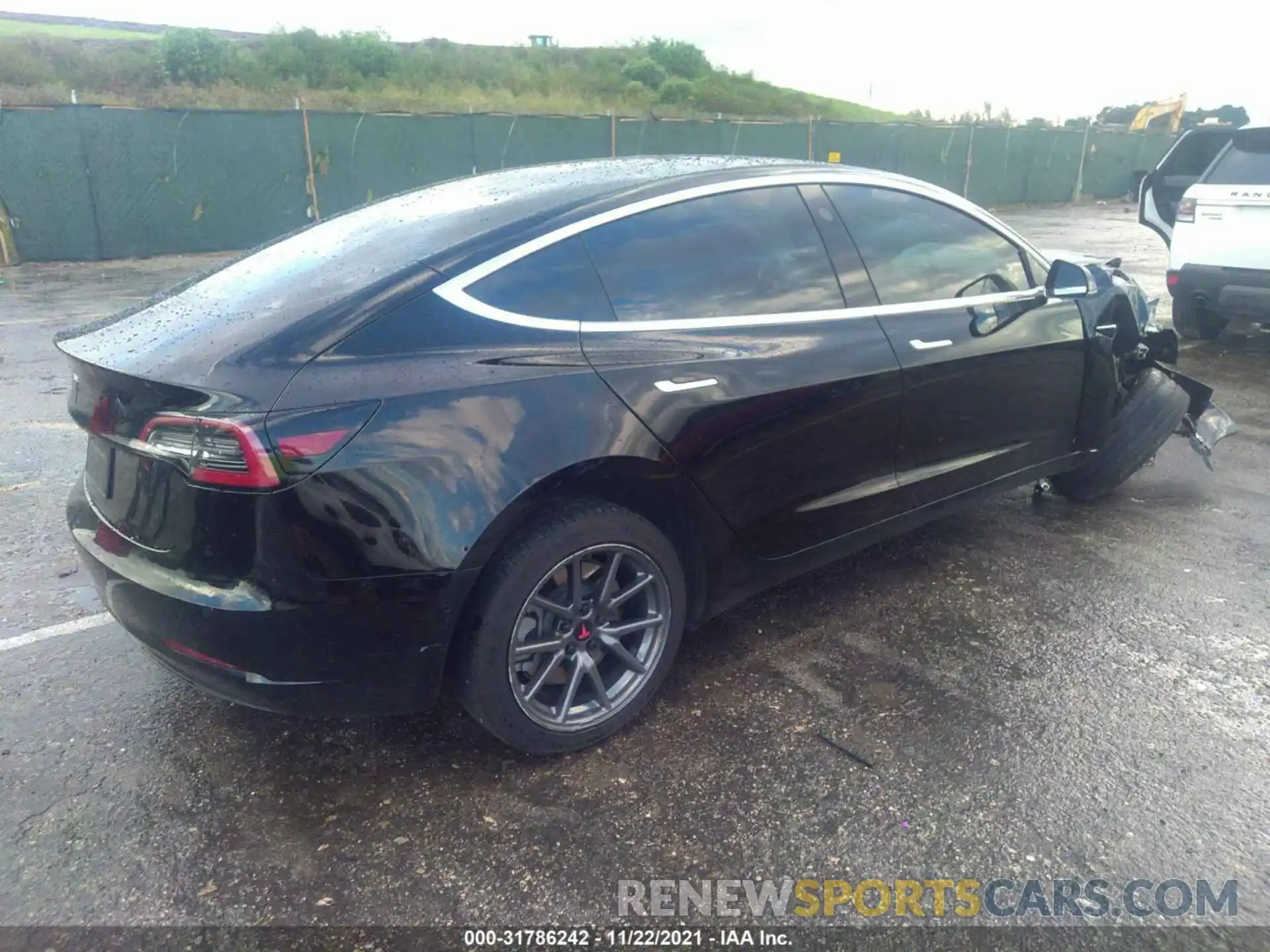 4 Photograph of a damaged car 5YJ3E1EA2LF657409 TESLA MODEL 3 2020