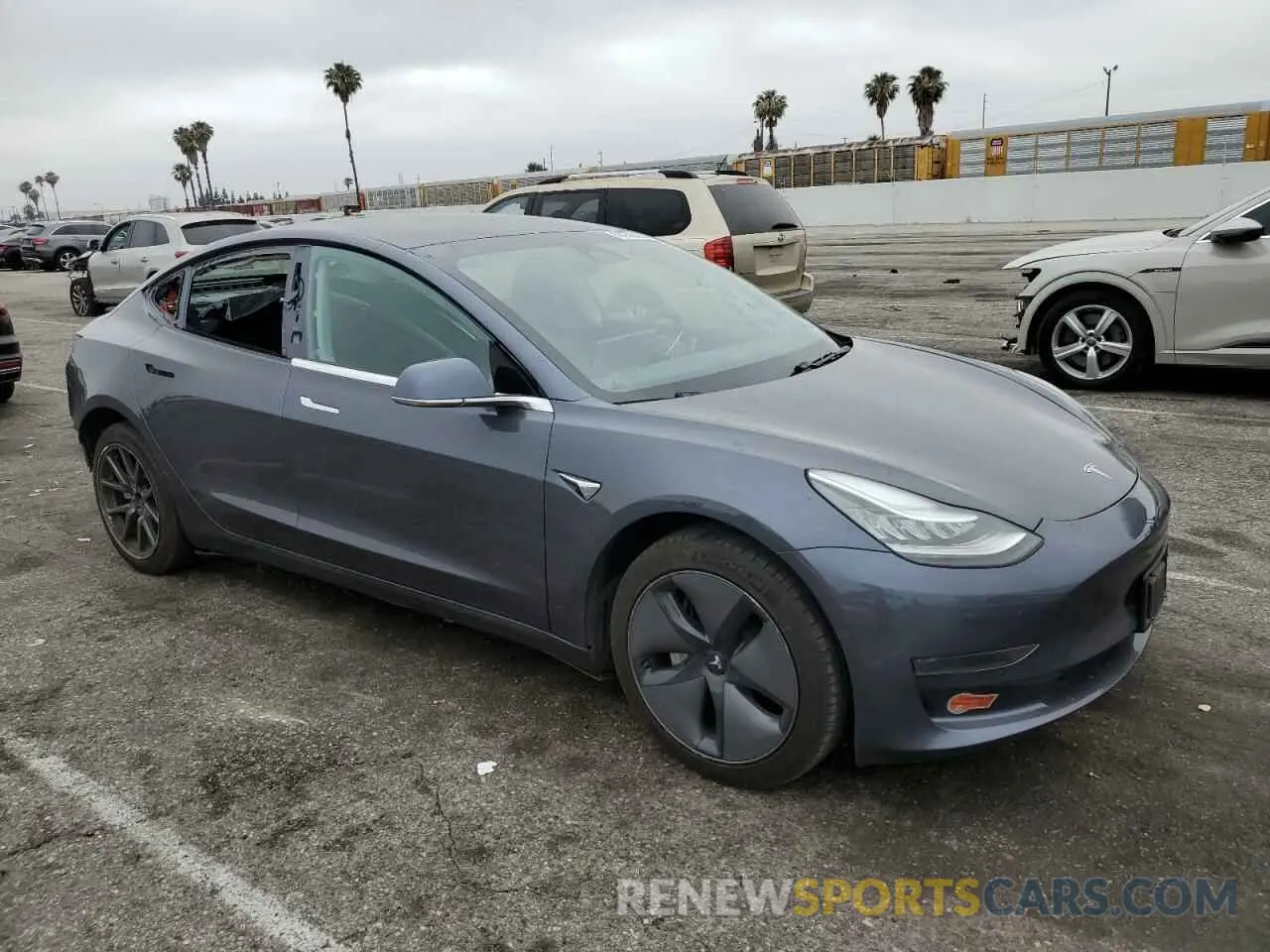 4 Photograph of a damaged car 5YJ3E1EA2LF704941 TESLA MODEL 3 2020