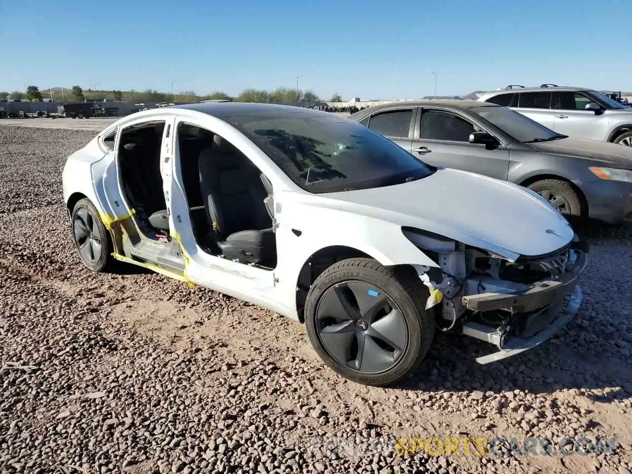 4 Photograph of a damaged car 5YJ3E1EA2LF706186 TESLA MODEL 3 2020