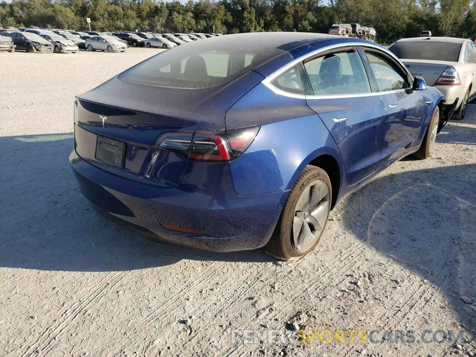 4 Photograph of a damaged car 5YJ3E1EA3LF590397 TESLA MODEL 3 2020