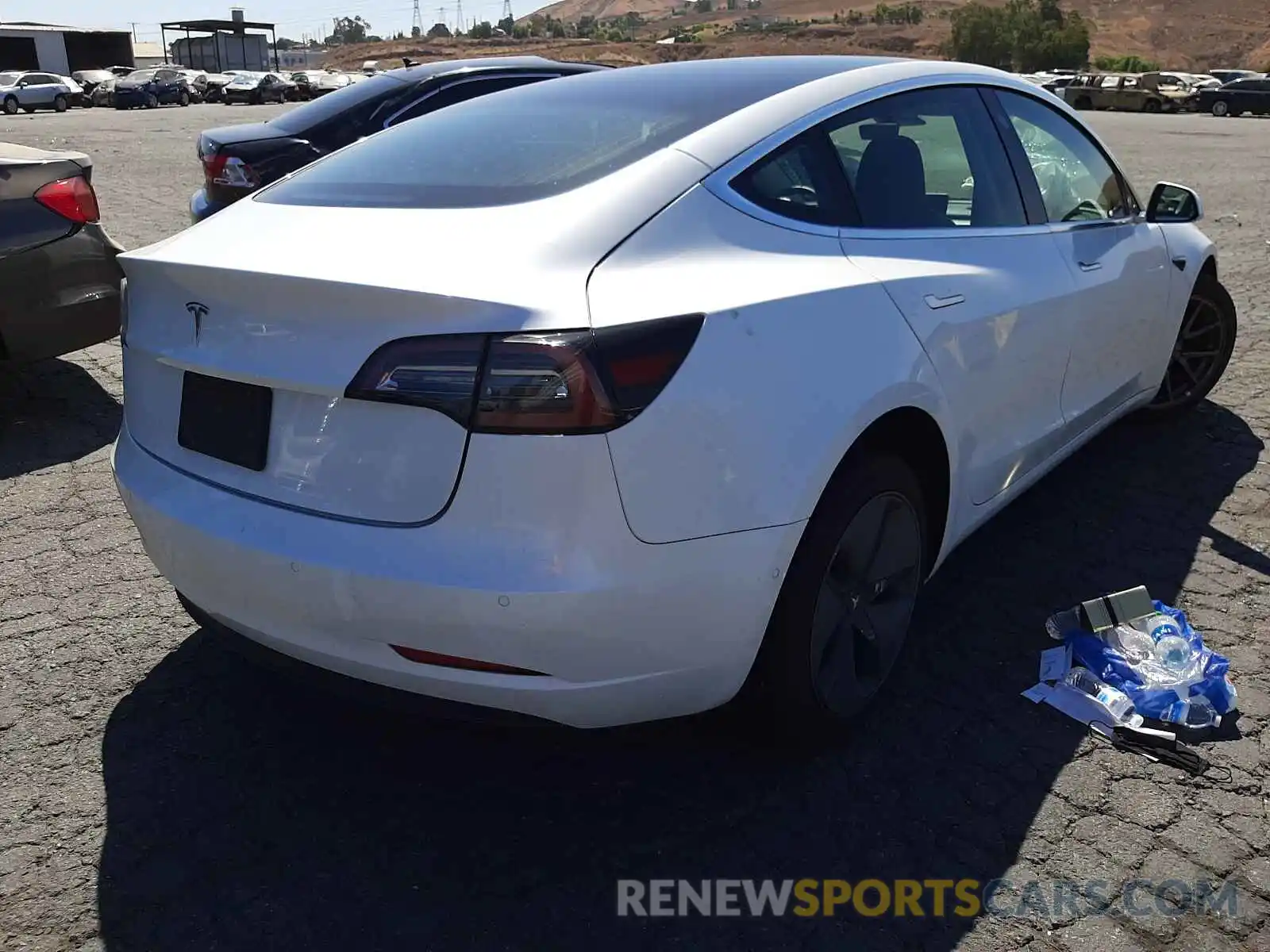 4 Photograph of a damaged car 5YJ3E1EA4LF745149 TESLA MODEL 3 2020