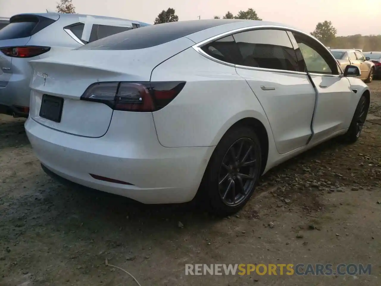 4 Photograph of a damaged car 5YJ3E1EA6LF797365 TESLA MODEL 3 2020