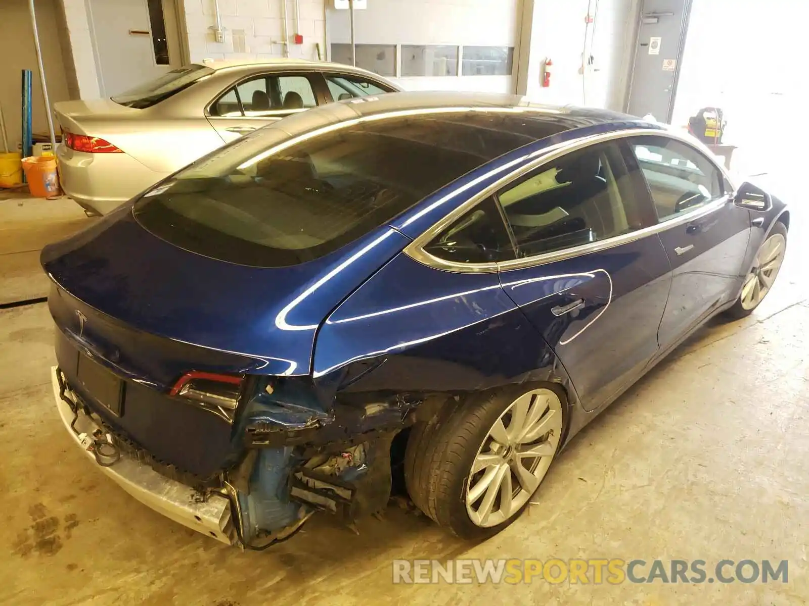 4 Photograph of a damaged car 5YJ3E1EAXLF708932 TESLA MODEL 3 2020