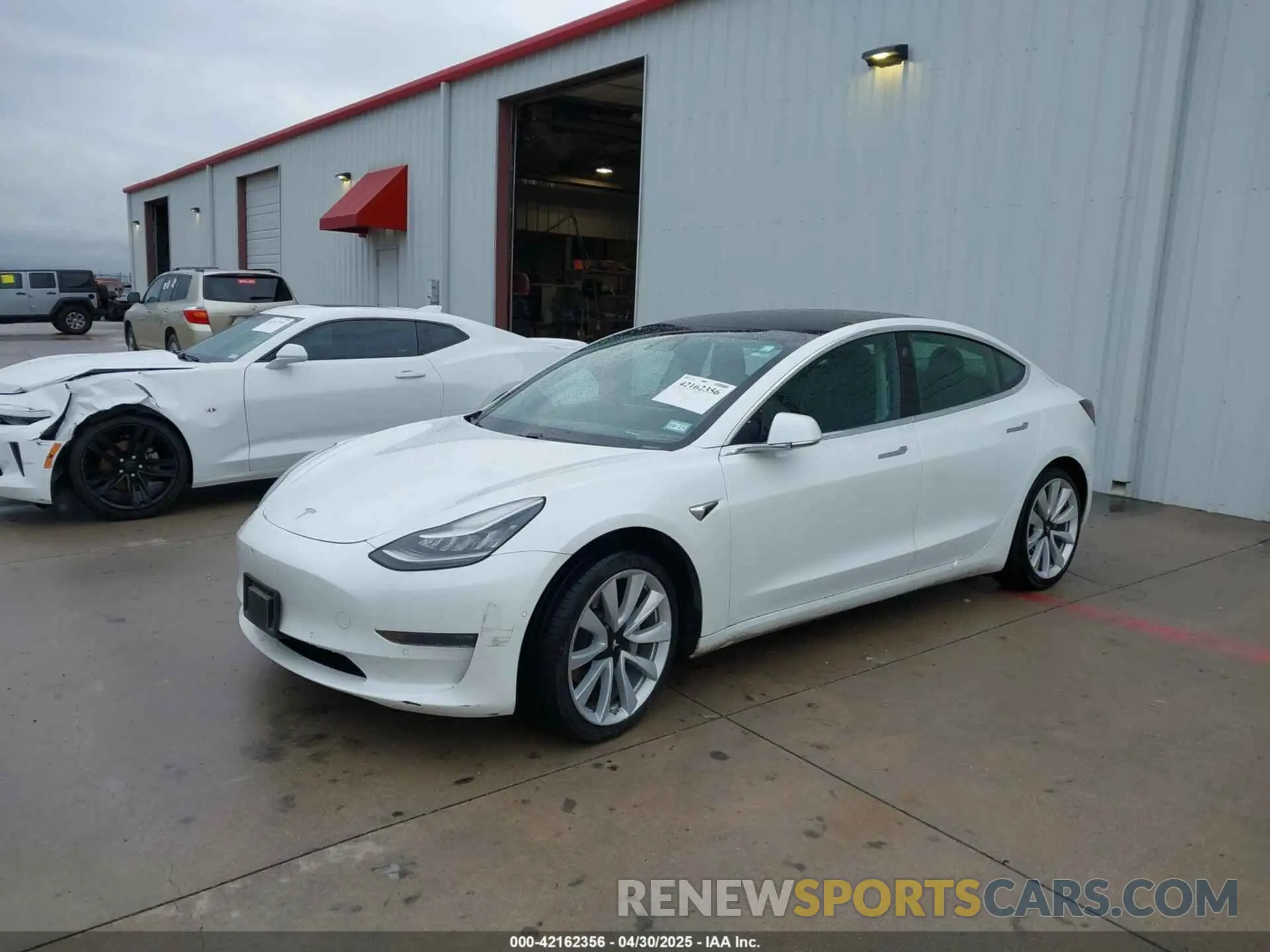2 Photograph of a damaged car 5YJ3E1EB2LF638612 TESLA MODEL 3 2020