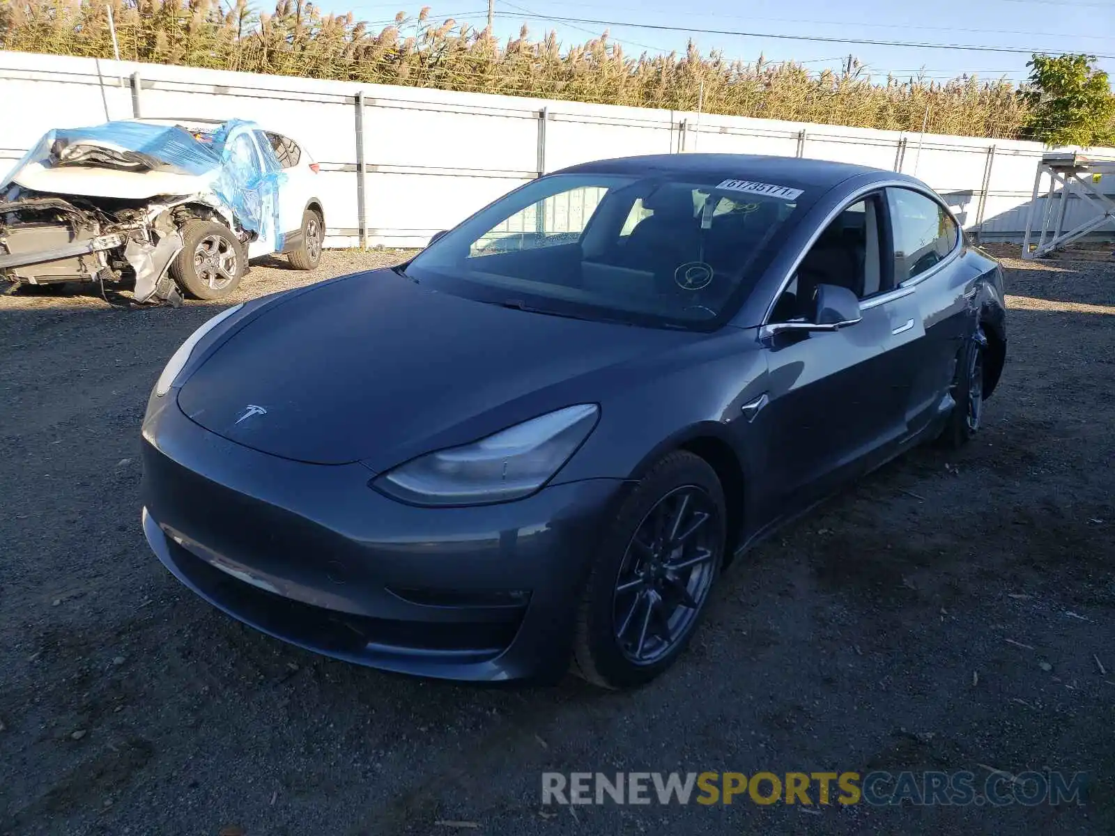 2 Photograph of a damaged car 5YJ3E1EB2LF663574 TESLA MODEL 3 2020