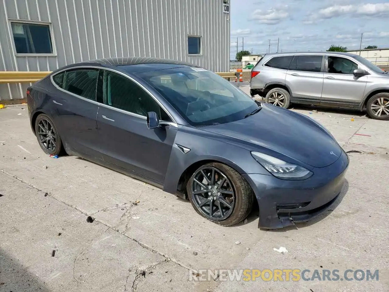 4 Photograph of a damaged car 5YJ3E1EB3LF734880 TESLA MODEL 3 2020